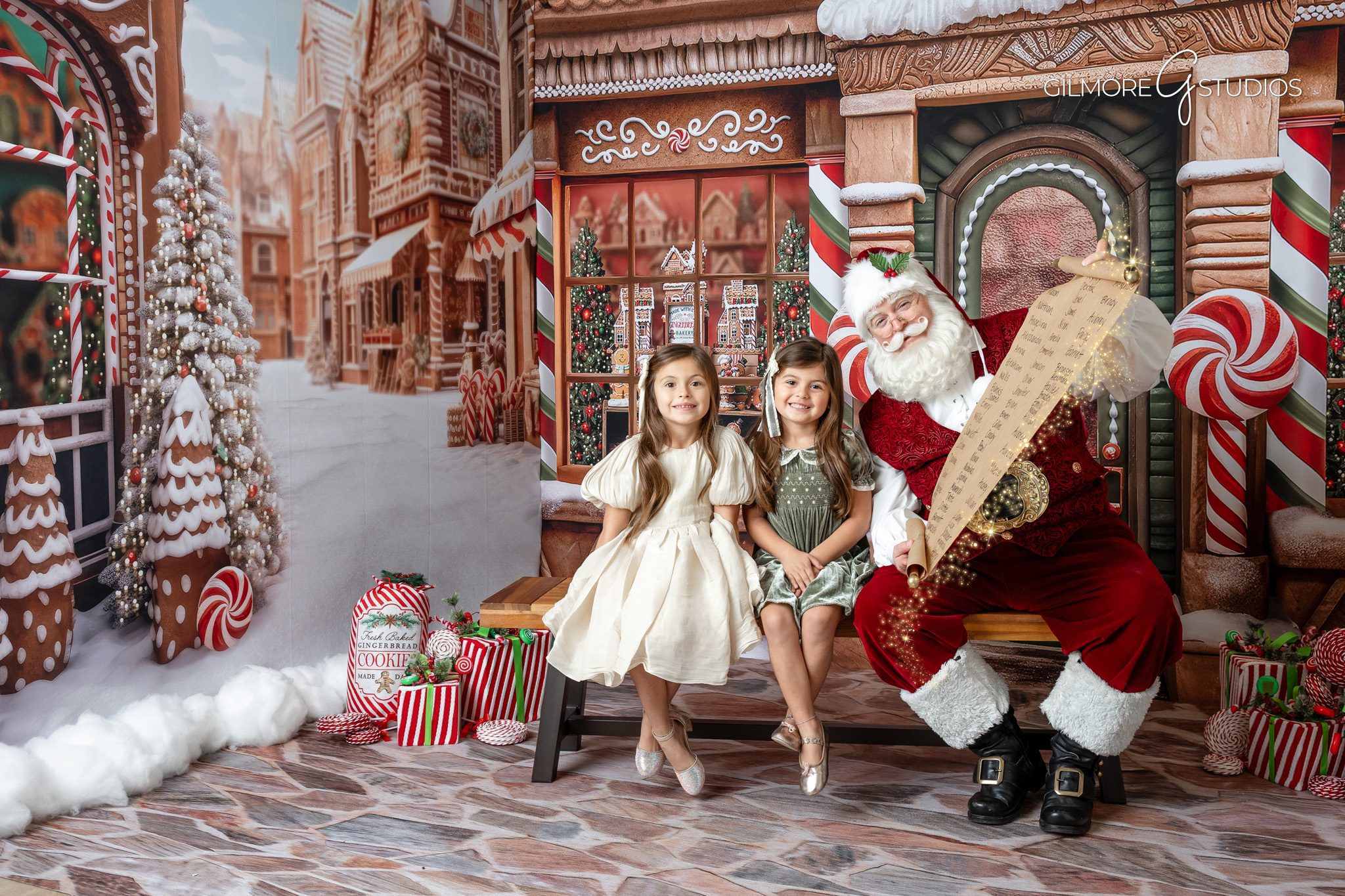 Orange County holiday mini photographer creating festive family portraits.

Santa photography with children sharing Christmas list during session.