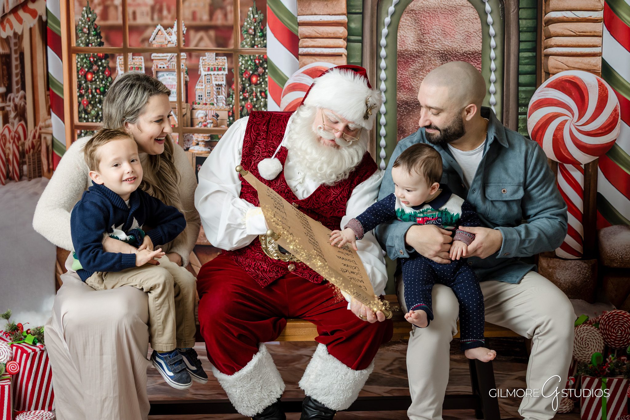 OC Santa photographer capturing candid joyful moment.

Toddler photographed with Santa during Christmas photo session.