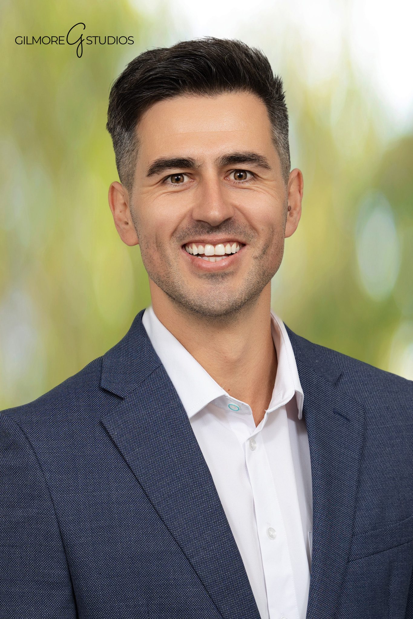 San Diego photographer taking candid photos at corporate leadership summit.
Business conference photography showing branded event signage and setup.