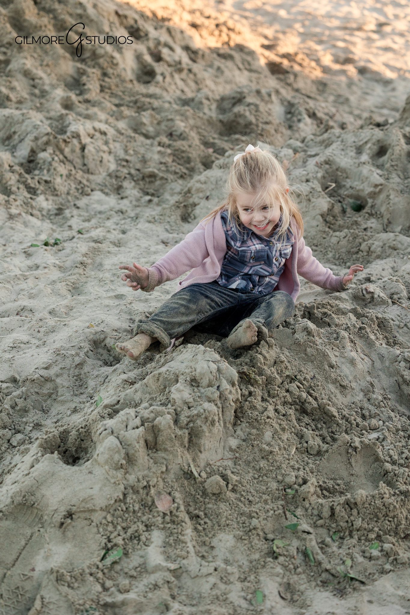 Beach family portrait photography featuring a young daughter at Newport Pier
Newport Beach family photography session capturing parent child connection at the pier