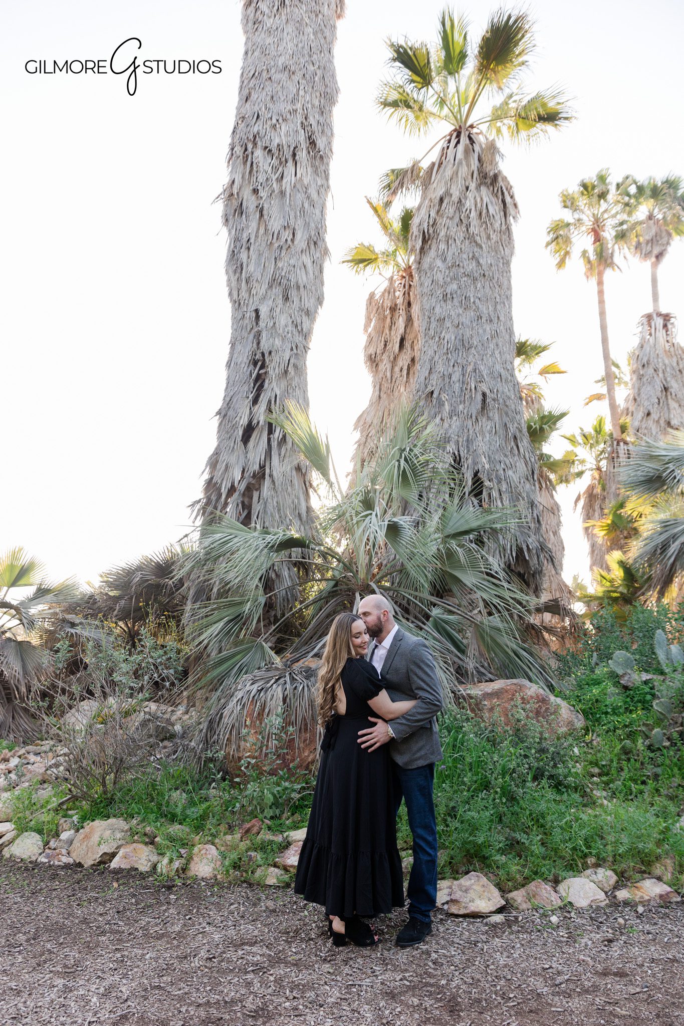Newport Beach engagement session photographed by a professional wedding photographer

ENC engagement photos featuring a couple walking along the coast