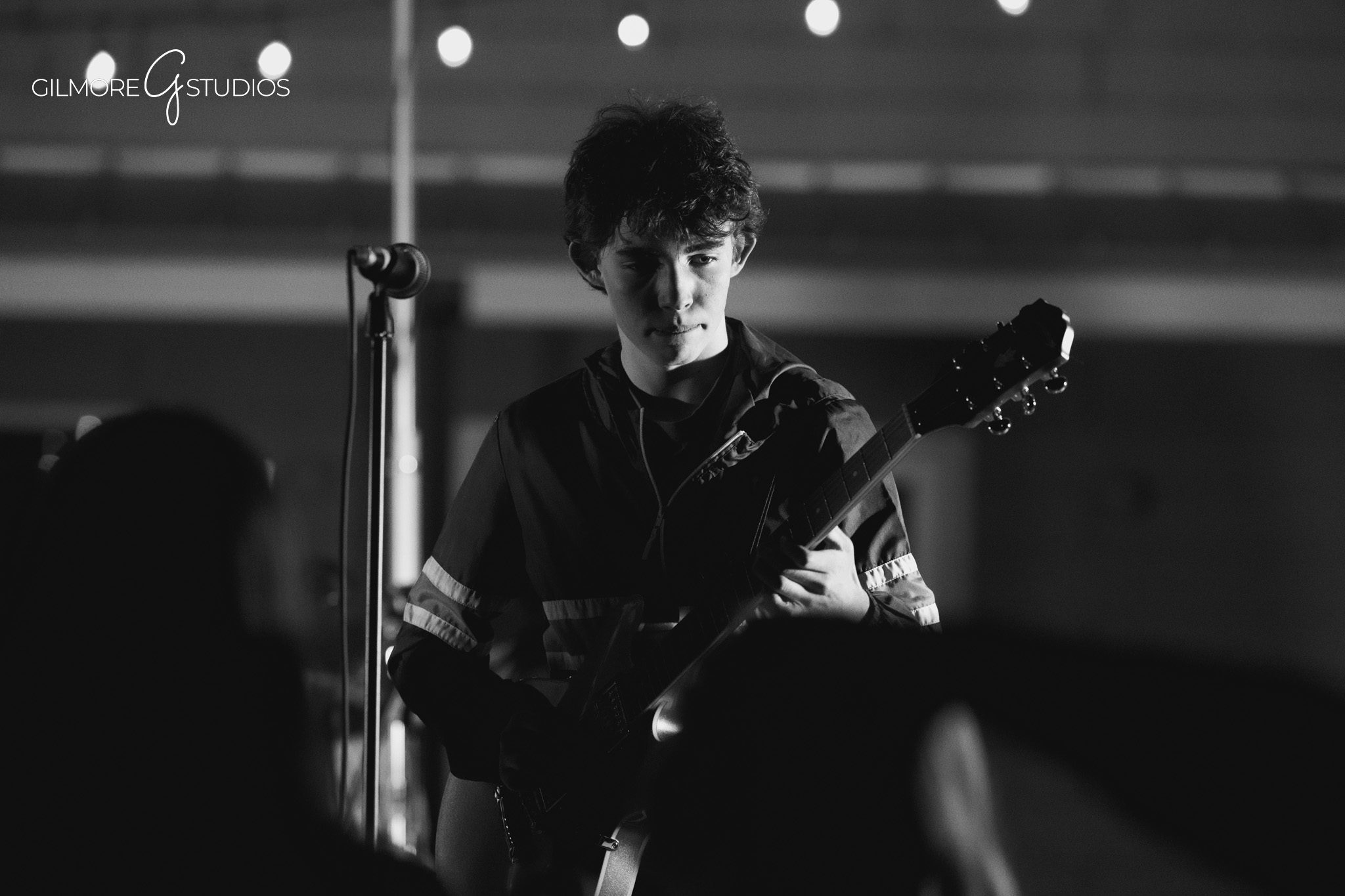 Gilbert Arizona concert photography with dynamic lighting and motion

Live music photography capturing band interaction on stage