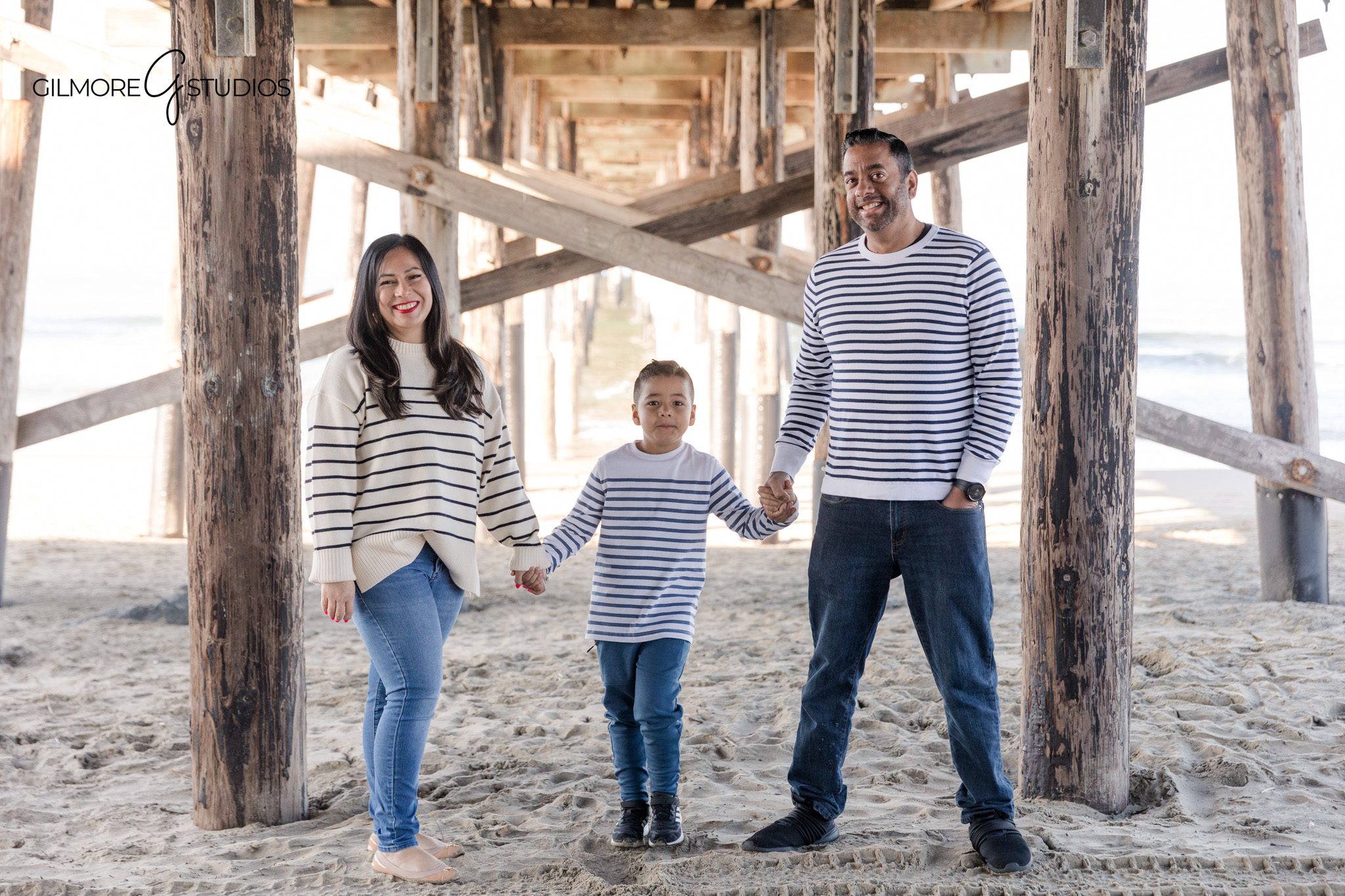 Beach birthday photography capturing a boy playing near Newport Pier

Newport Pier birthday portrait with a boy photographed by a professional photographer