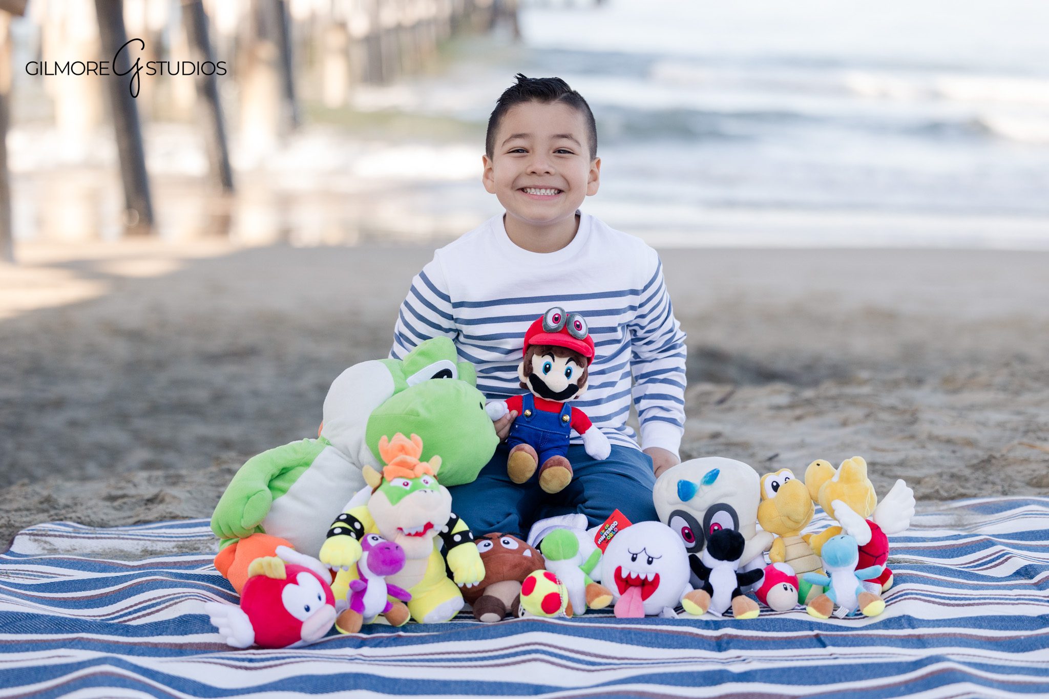 Beach birthday session for a boy photographed at Newport Pier by a Newport Beach child photographer

Newport Pier birthday portrait featuring a young boy photographed professionally