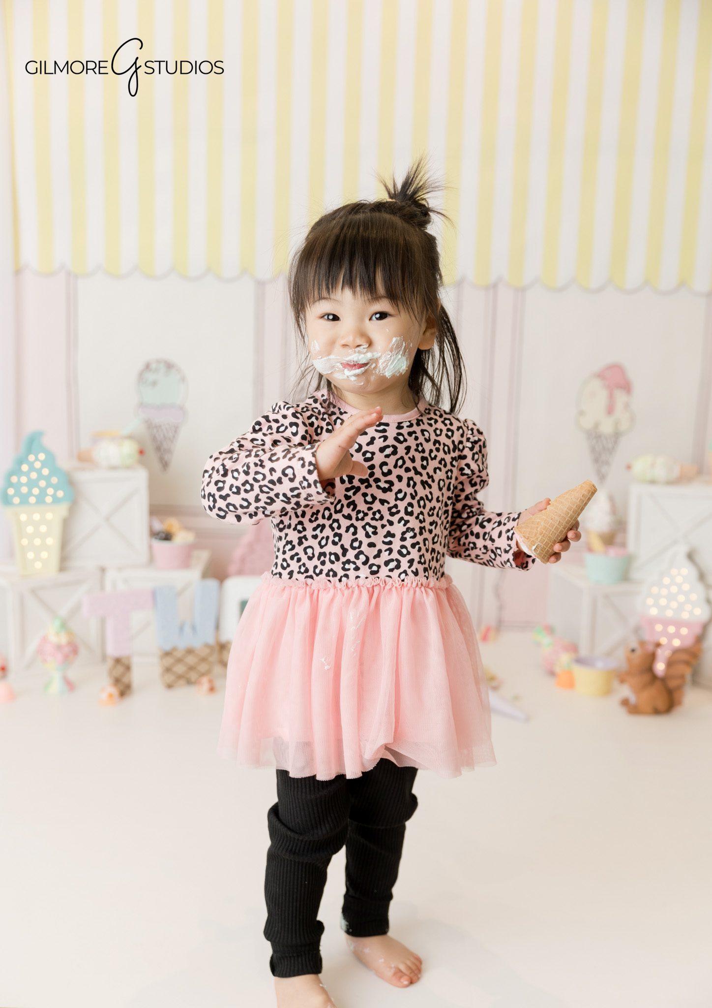 Ice cream shop birthday photography featuring a happy 2 year old
Toddler milestone photography captured by a professional child photographer