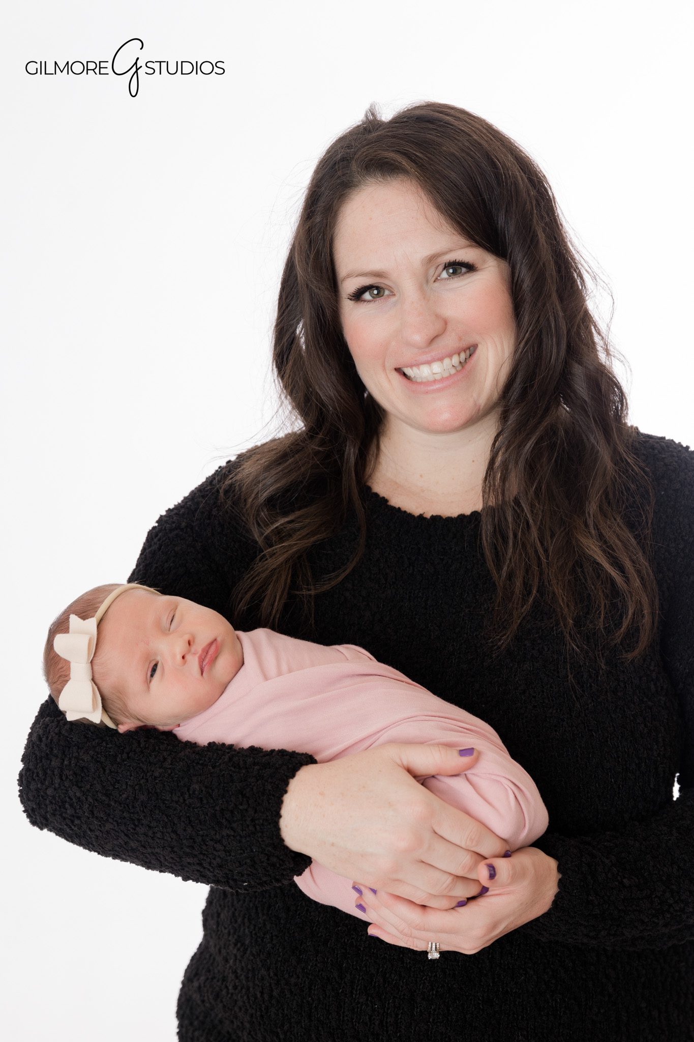 Luxury studio newborn photography capturing tiny newborn details

Fine art newborn portrait photography with a neutral studio backdrop