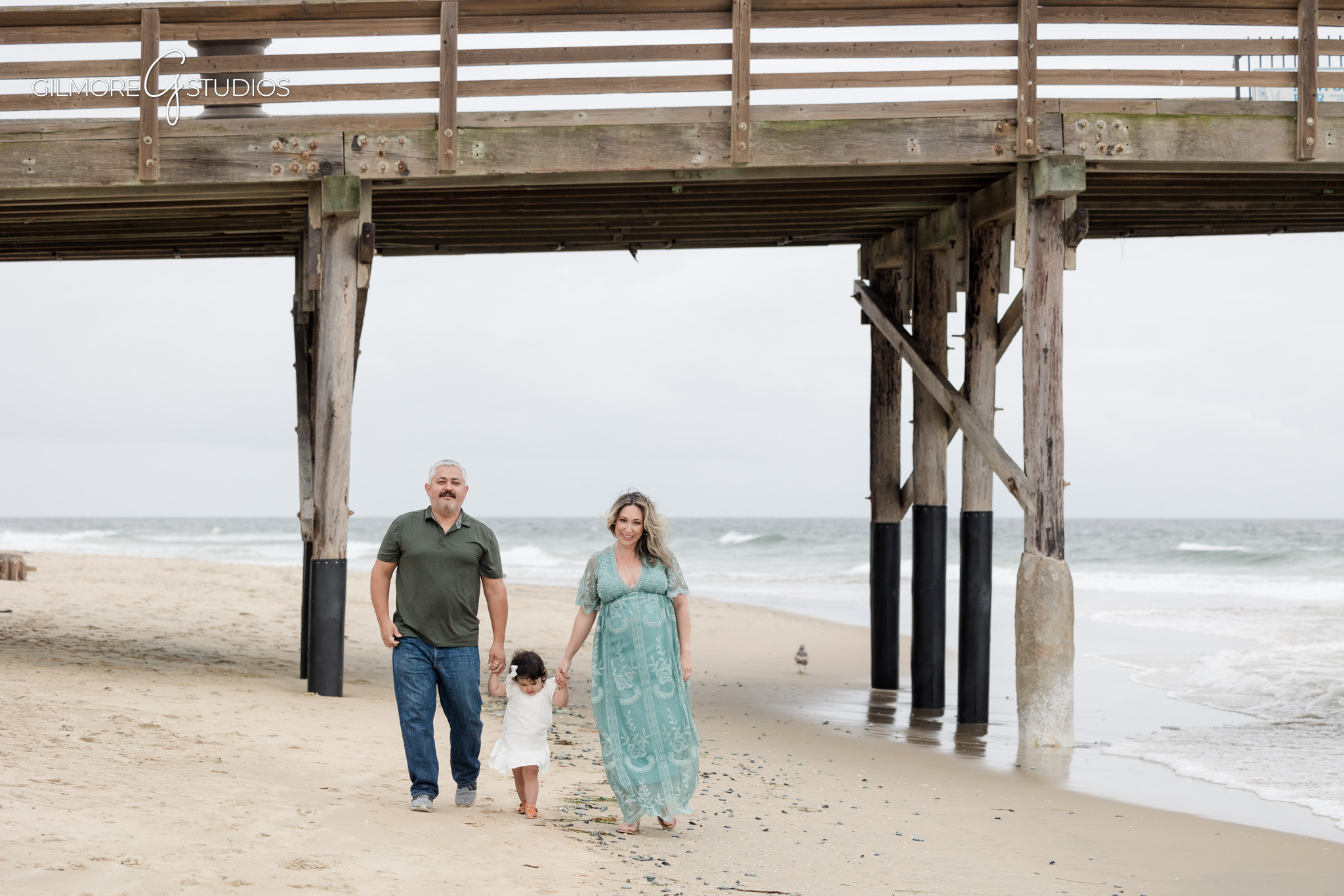 Beach pregnancy photos at Newport Pier captured by a professional photographer
Newport Pier maternity photography featuring gentle movement and light