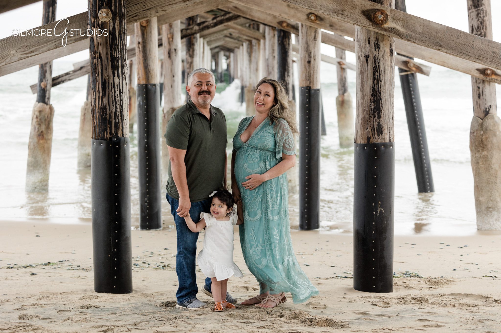 Newport Beach maternity photography session with flowing fabrics
Coastal maternity portrait photography featuring an expecting mother