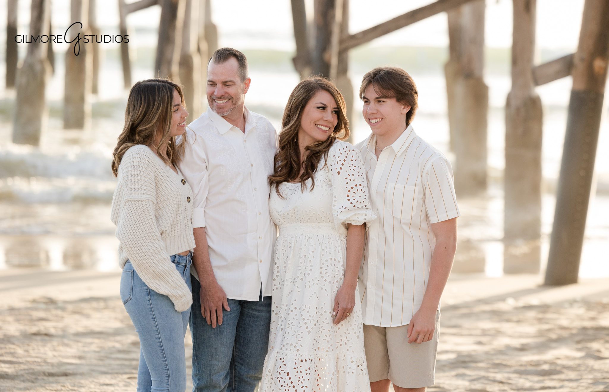 Newport Beach family photographer documenting a family walking along the pier

Pier family portrait photography with ocean backdrop in Newport Beach