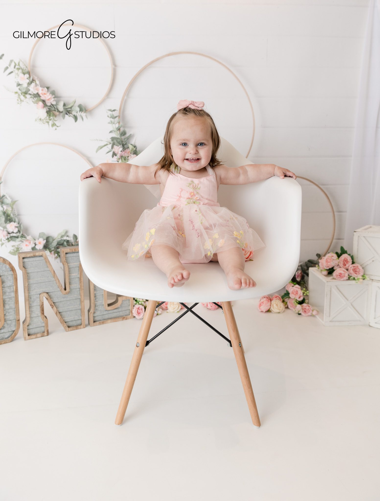 One year old cake smash photography captured in a studio setting

Newport Beach cake smash portrait photography with soft natural tones