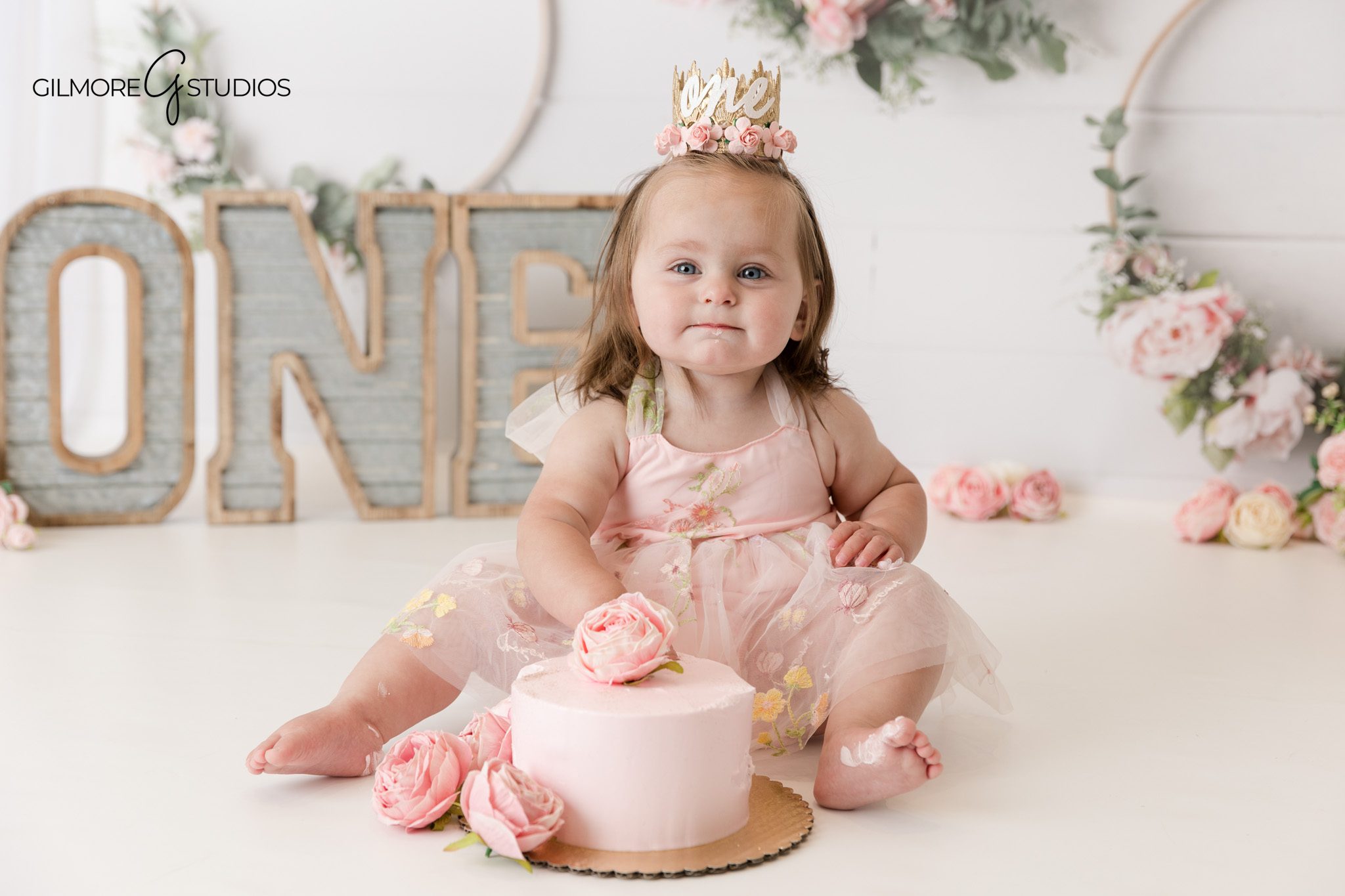 Professional cake smash portrait photographed by Gilmore Studios

Baby photography session capturing a one year old milestone