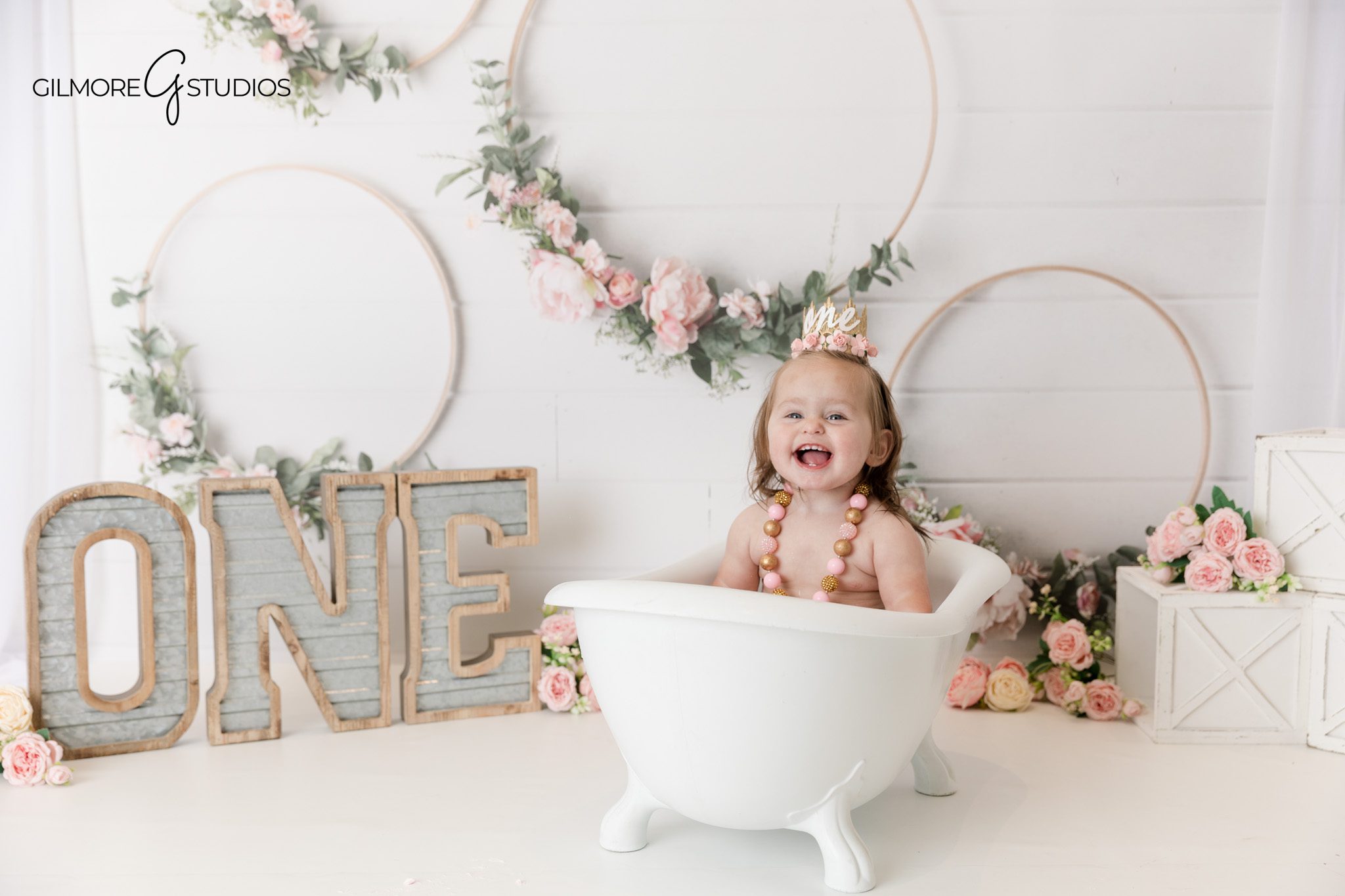 Professional baby photographer documenting a cake smash session

First birthday photography captured in a Newport Beach studio