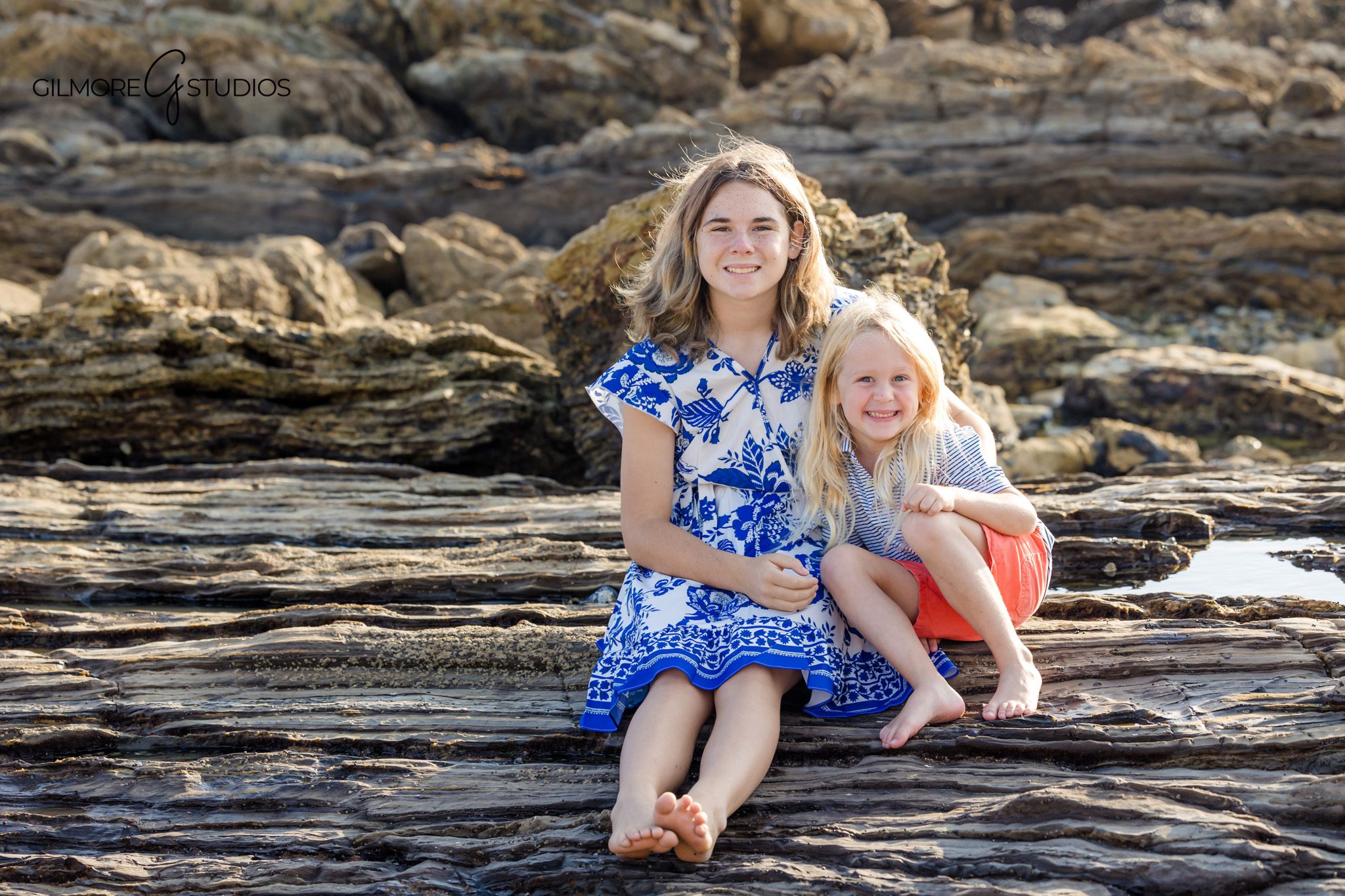 Engagement photographer capturing couple forehead-to-forehead moment.

Corona del Mar family photographer documenting group beach portrait.
