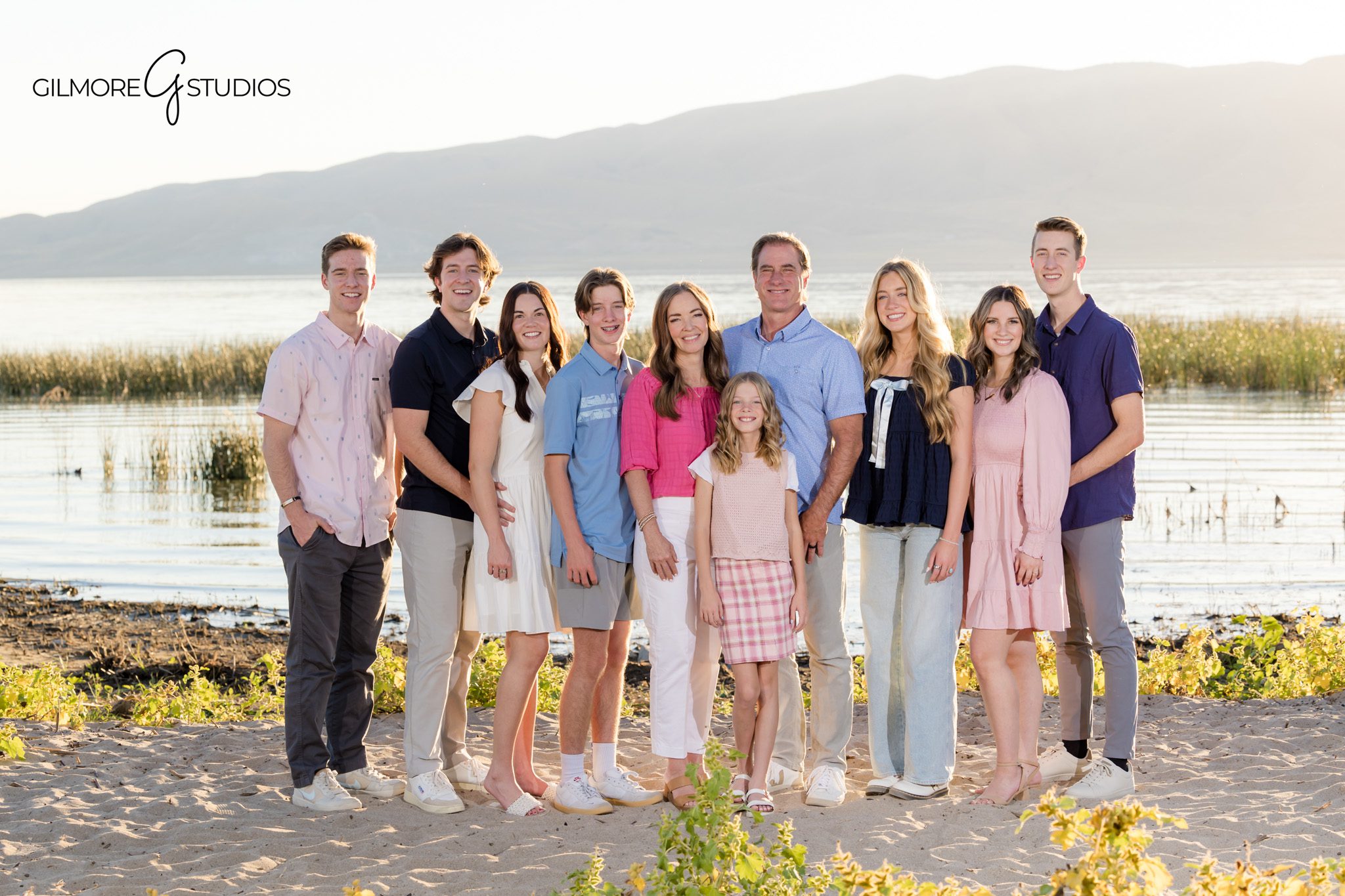 Lifestyle portrait photographer capturing Karalynne Call with her children in Utah mountains.

Utah photography of family walking through natural landscape during sunset.
