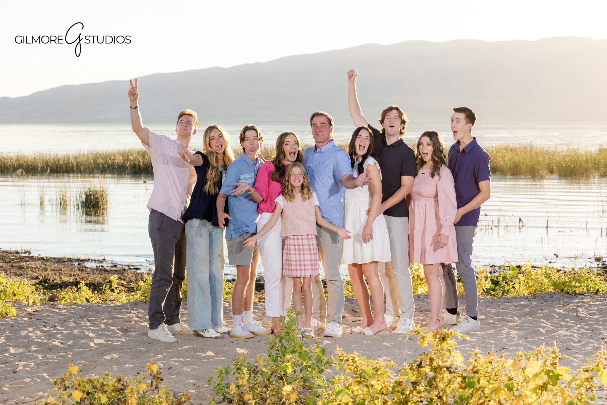 Outdoor portrait photography with Utah valley scenery.

Family photographer capturing candid laughter during Utah photoshoot.