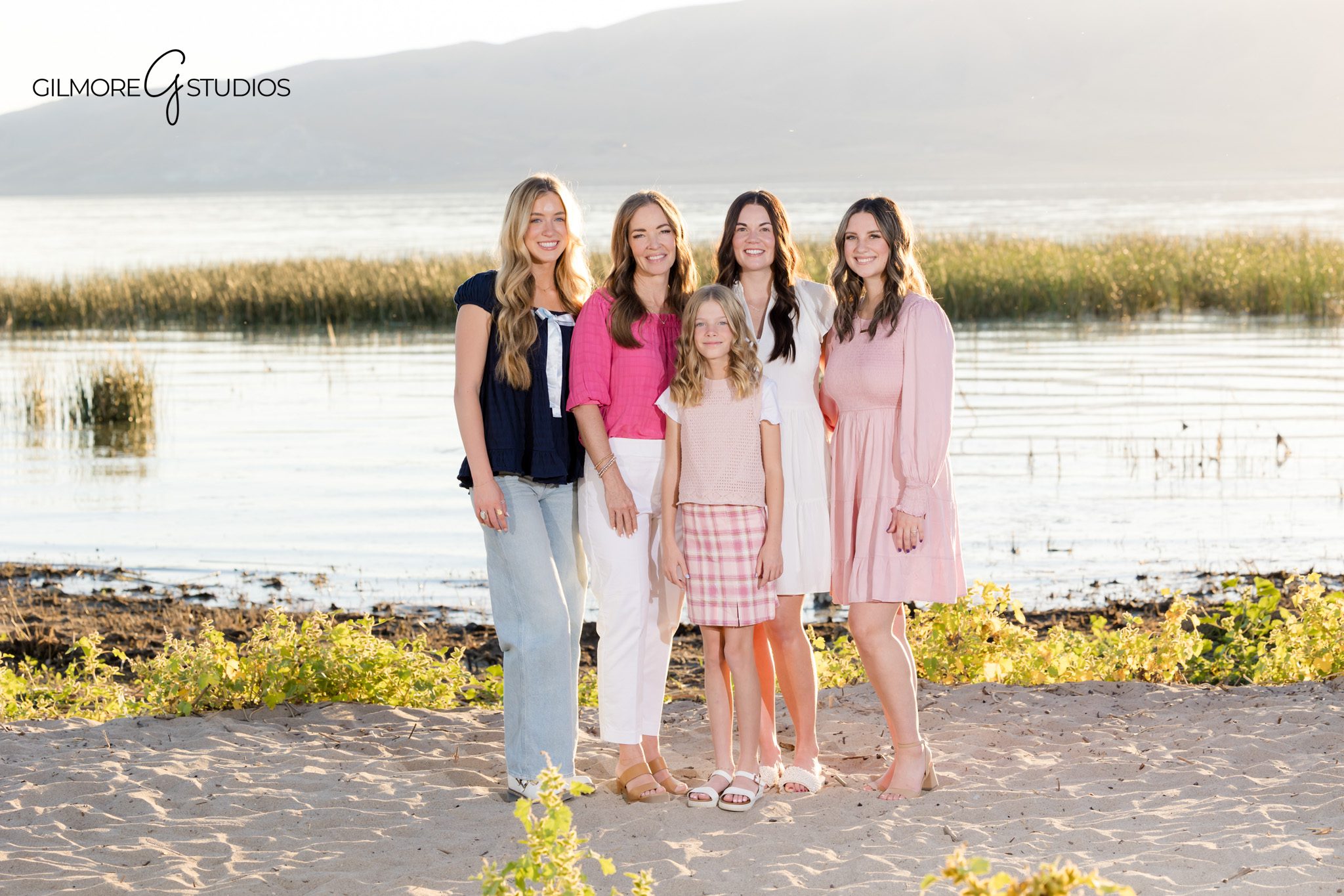 Utah candid photographer documenting playful outdoor moments.

Gilmore Studios portrait of mother and kids cuddling.
