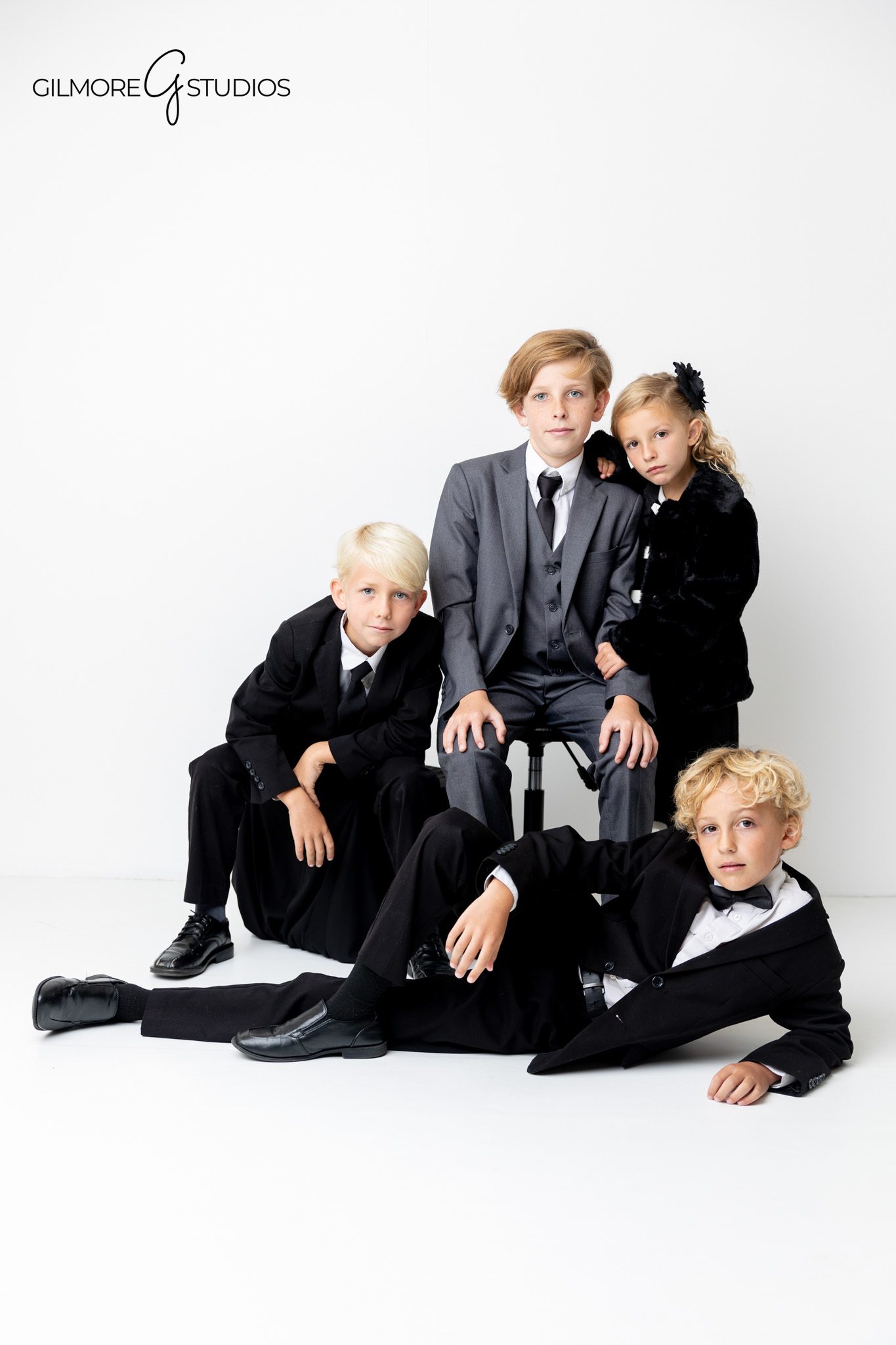Newport Beach portrait photographer capturing timeless family studio look.

Elegant family photography in studio with elevated formal styling.