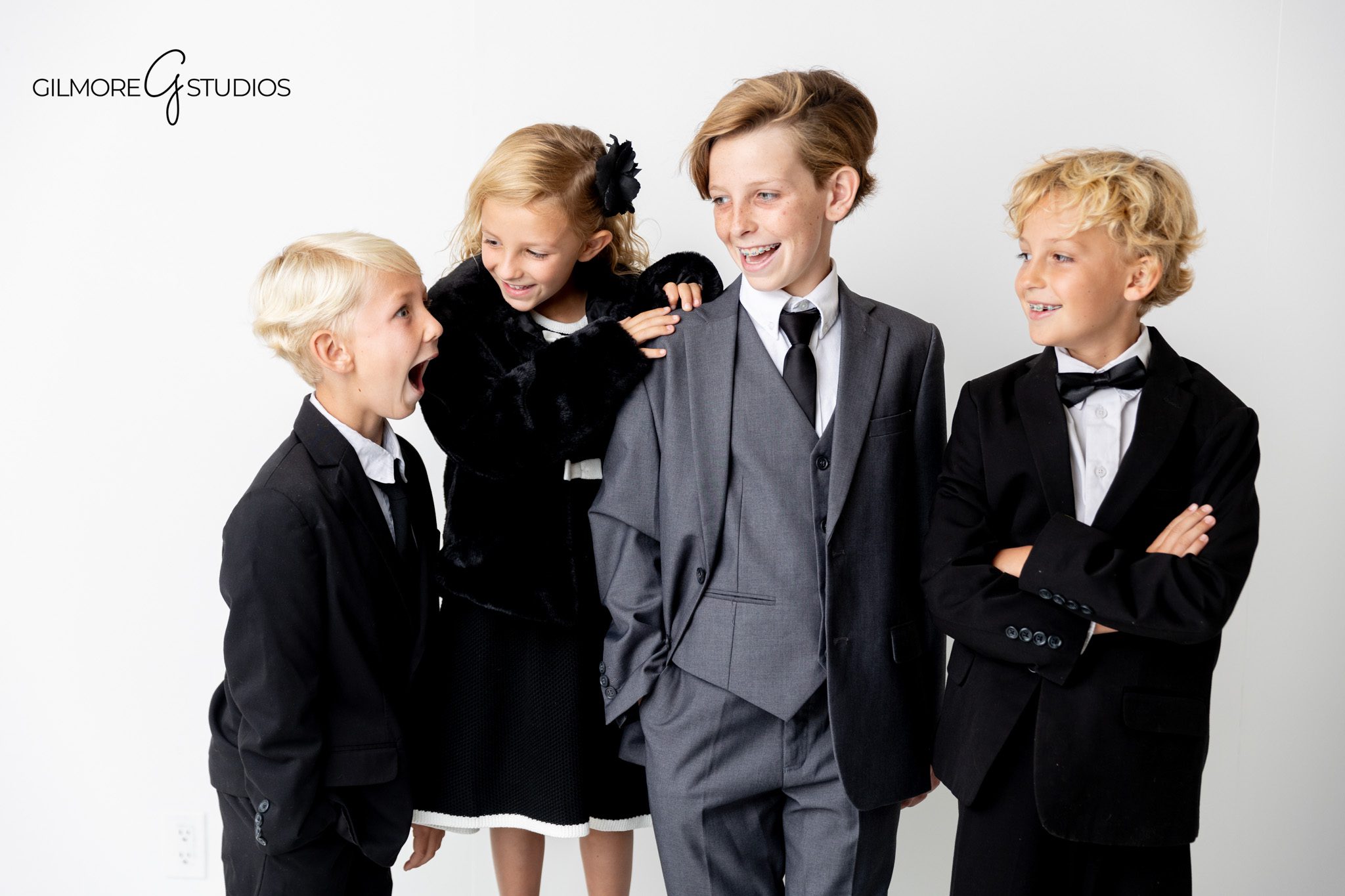 Newport Beach photographer capturing dignified family grouping.

Professional photographer capturing full-length family studio portraits.