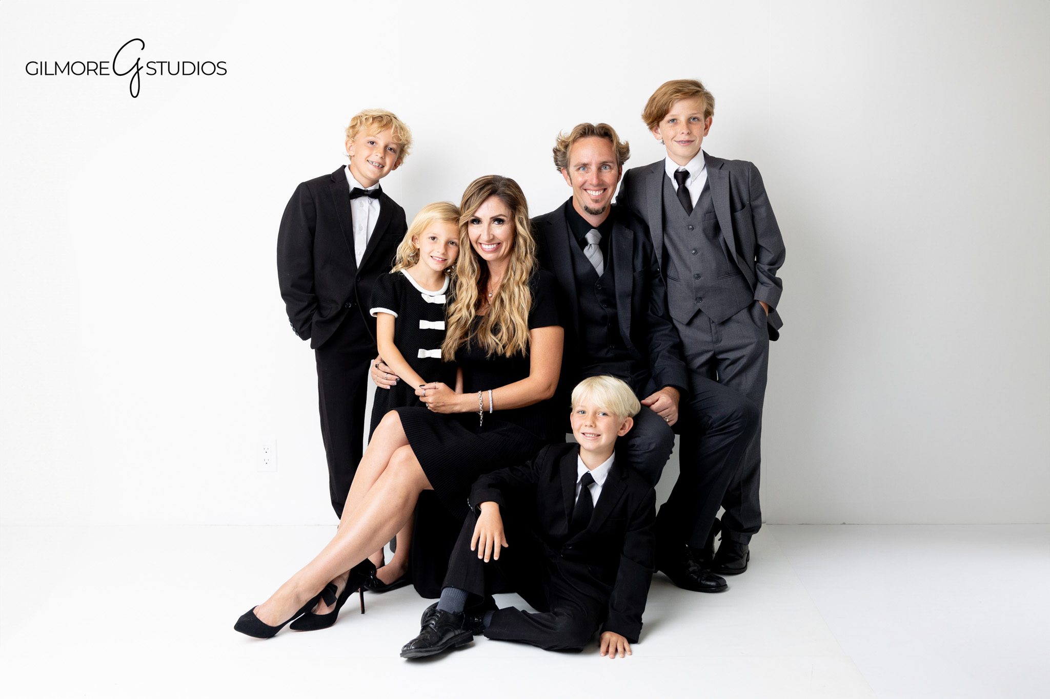 Newport Beach studio family photographer capturing formal portraits on white background.

Studio family photography with elegant formal outfits in Newport Beach.
