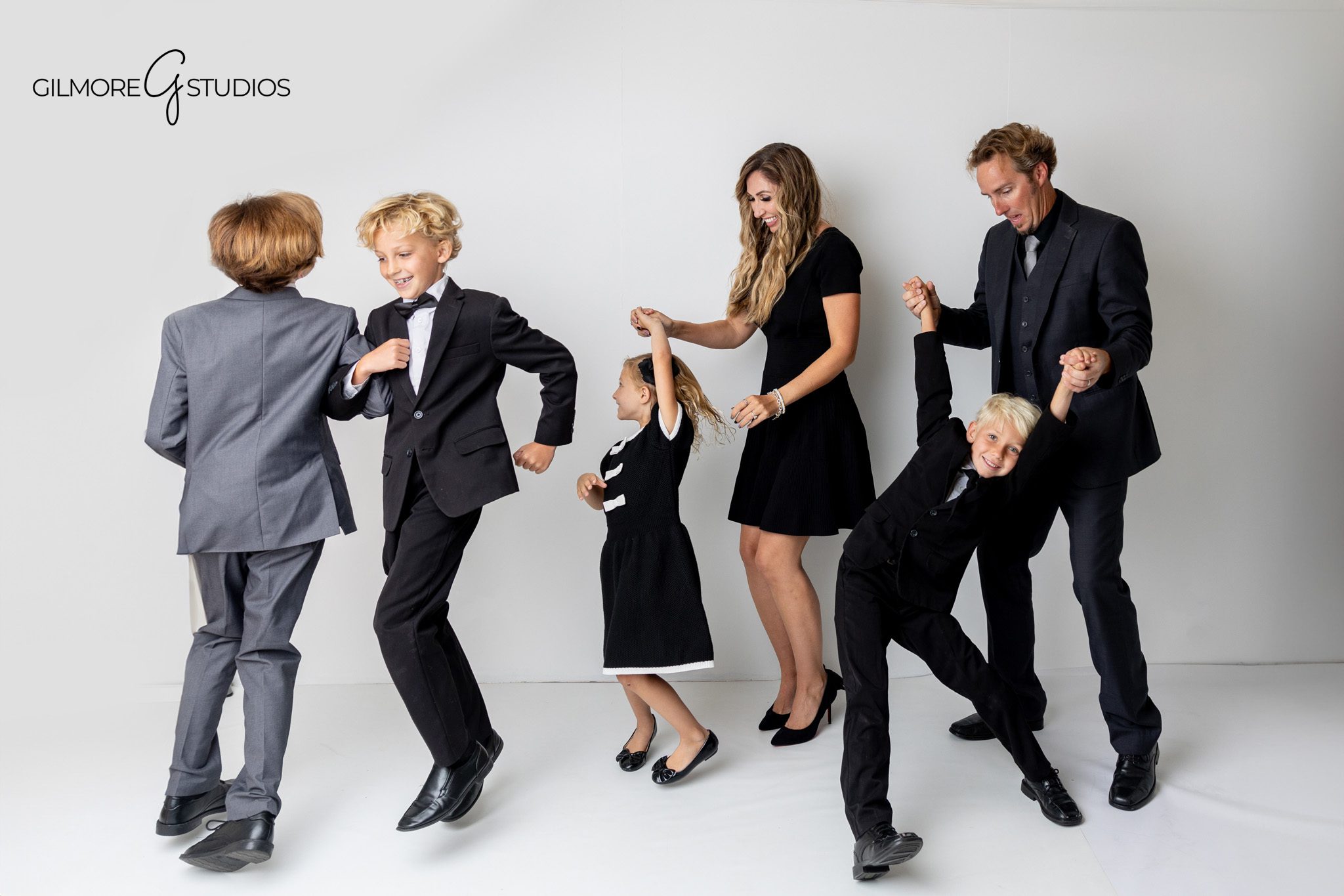 Newport Beach formal outfit portrait session with soft studio lighting.

Clean and minimal photography capturing family in timeless formal attire.