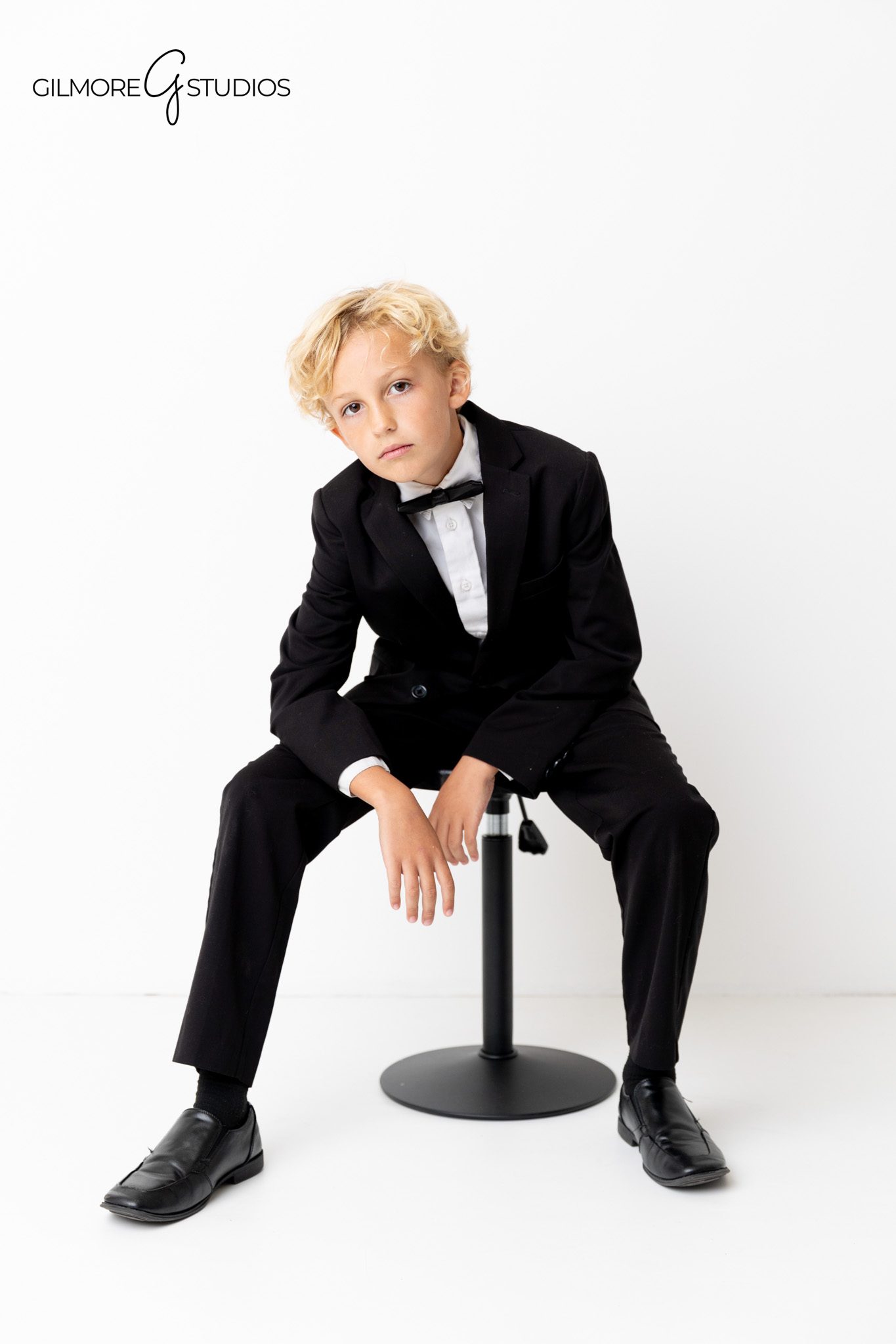 Clean white background portrait photography of stylish family.

Professional headshot and family photographer capturing modern group portrait.