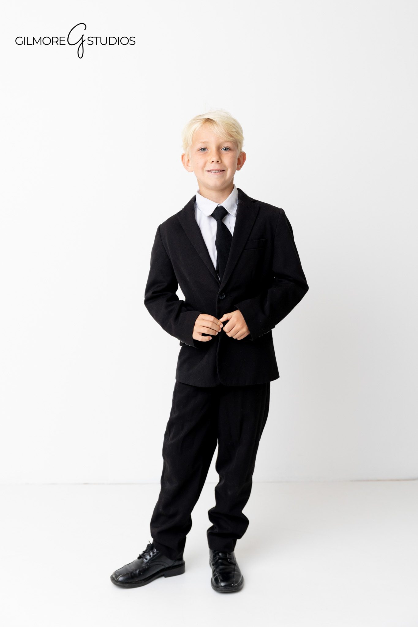 Newport Beach photographer capturing editorial-style family portrait session.

Formal family photography with modern studio lighting and crisp white background.