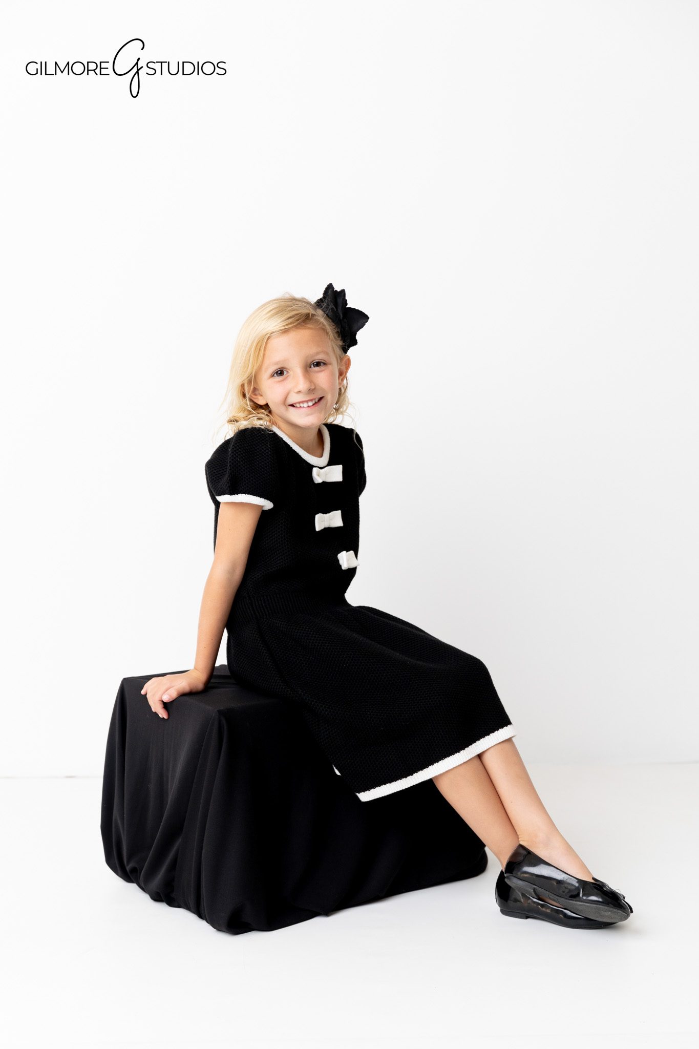 Studio portrait photography with soft lighting and polished family styling.

Newport Beach family photographer capturing formal group portrait.