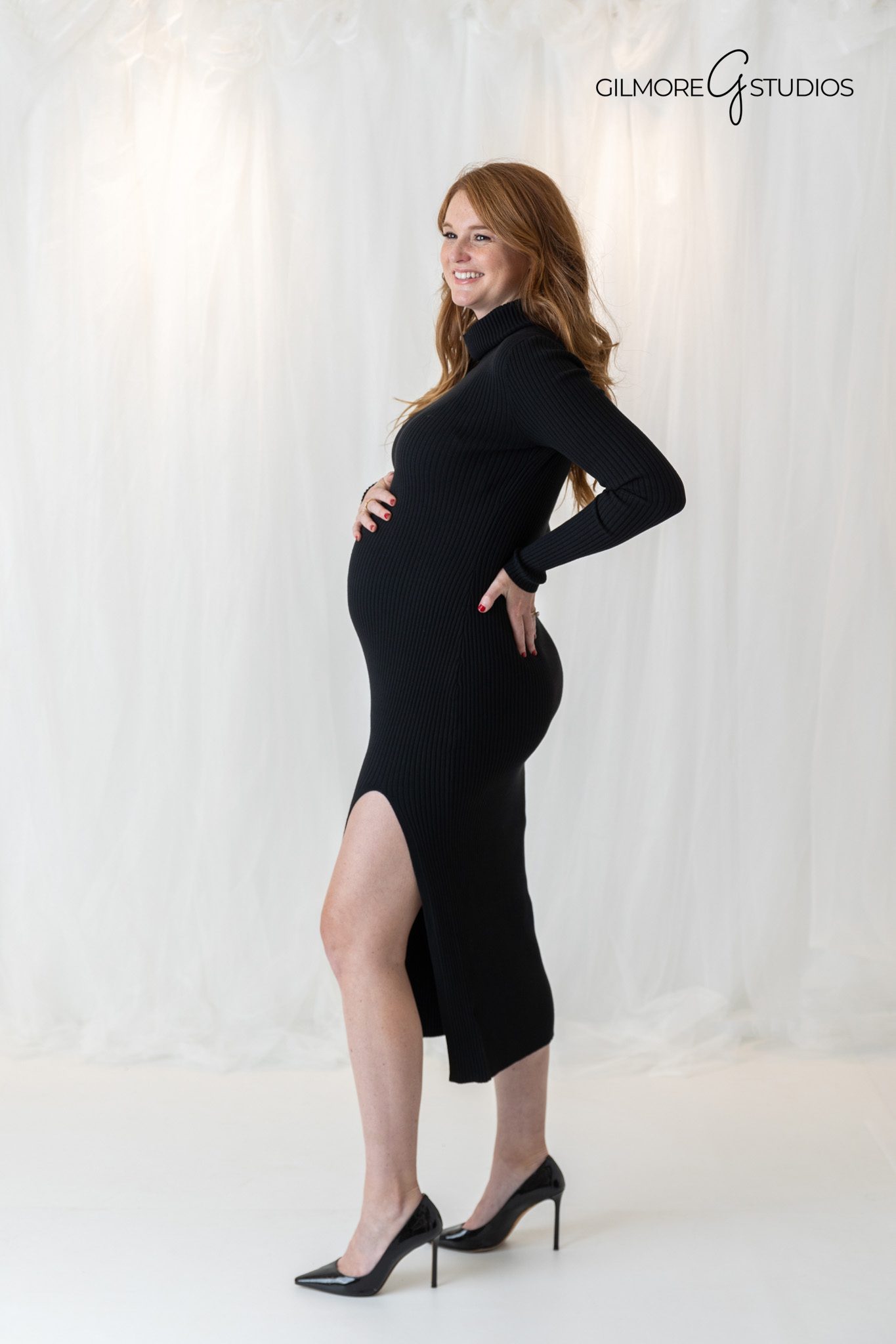mother to be posing in studio maternity session

sophisticated maternity portrait with minimal styling