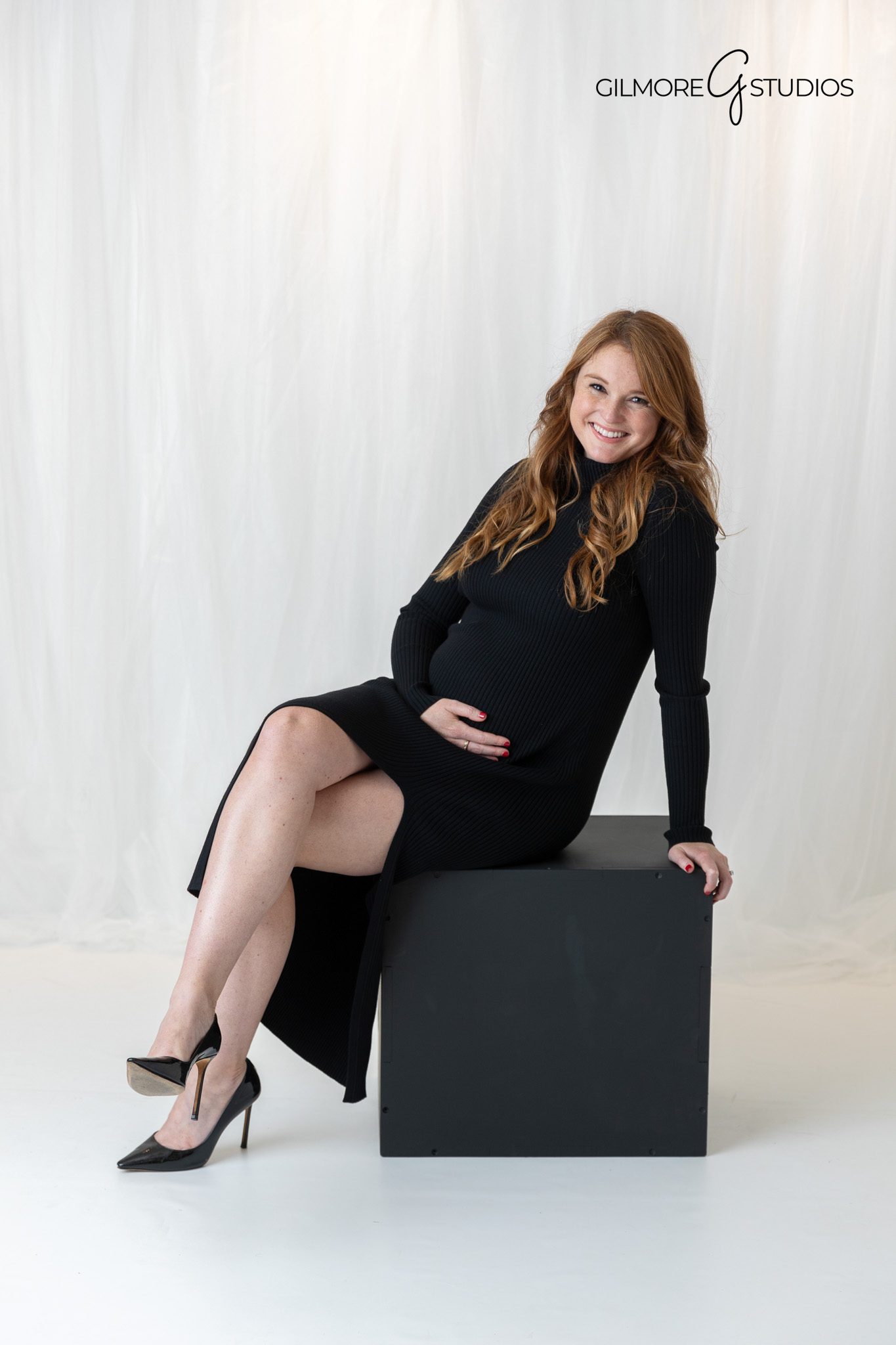 studio portrait of expecting mother in neutral tones

creative maternity silhouette photo black and white