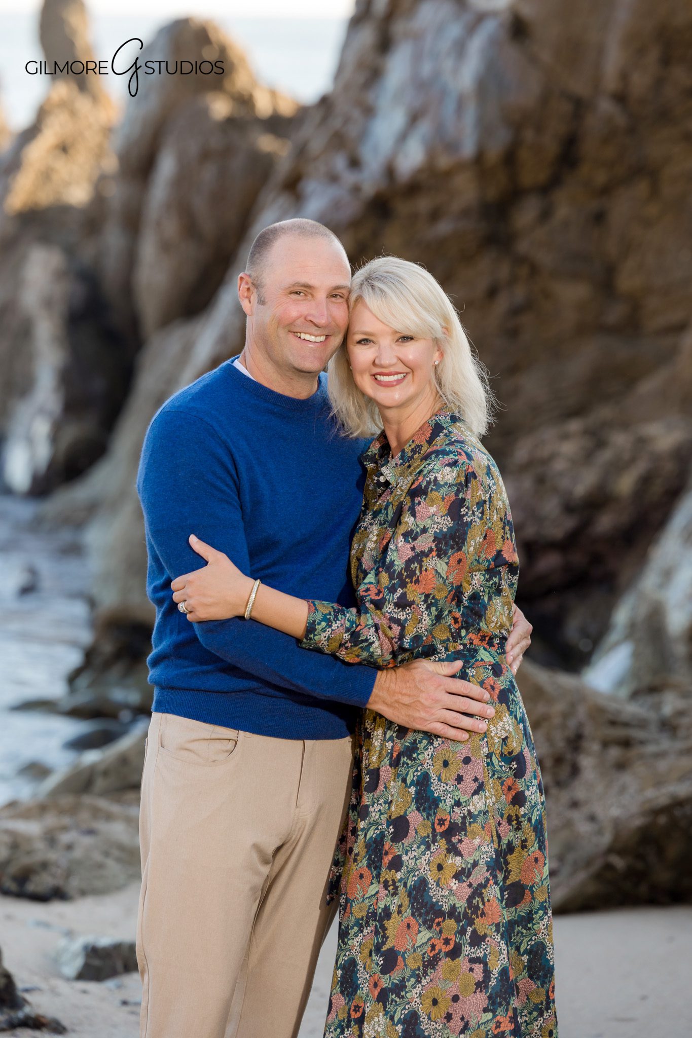 Family portrait photographer capturing playful shoreline moments.

Candid family photography of kids running along Little Corona waves.