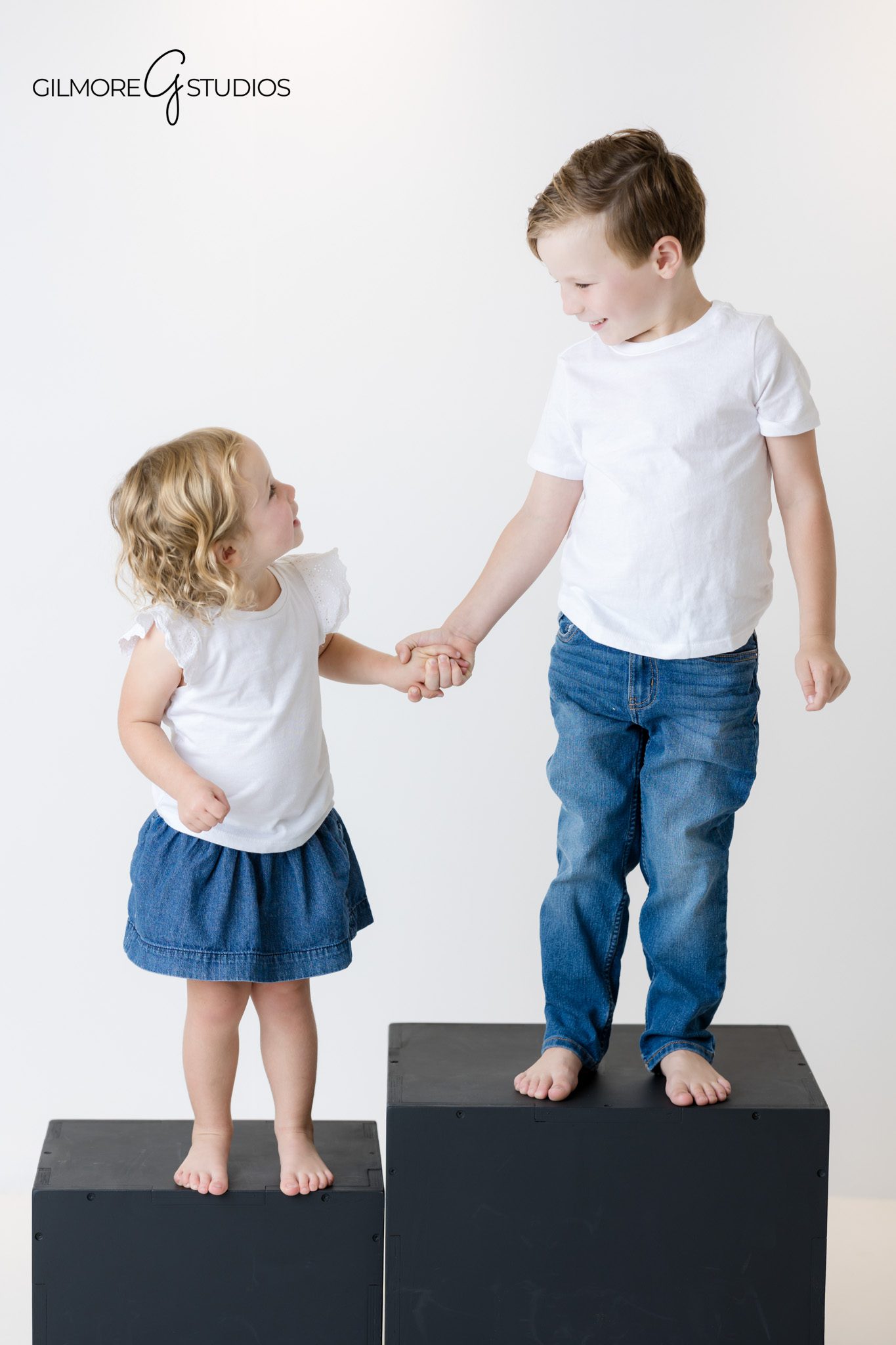 Natural family portraits in bright studio environment.

Studio family photographer capturing sweet parent and child moment.