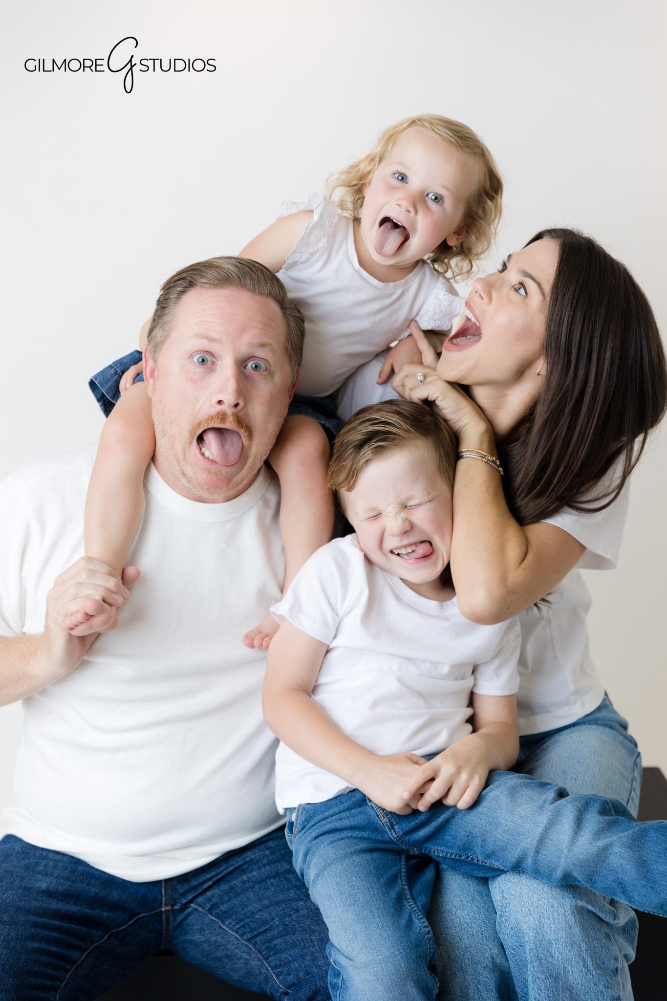 Family photographer focusing on clean, modern studio portrait style.

Coordinated white shirt and jeans photography for families in Orange County.