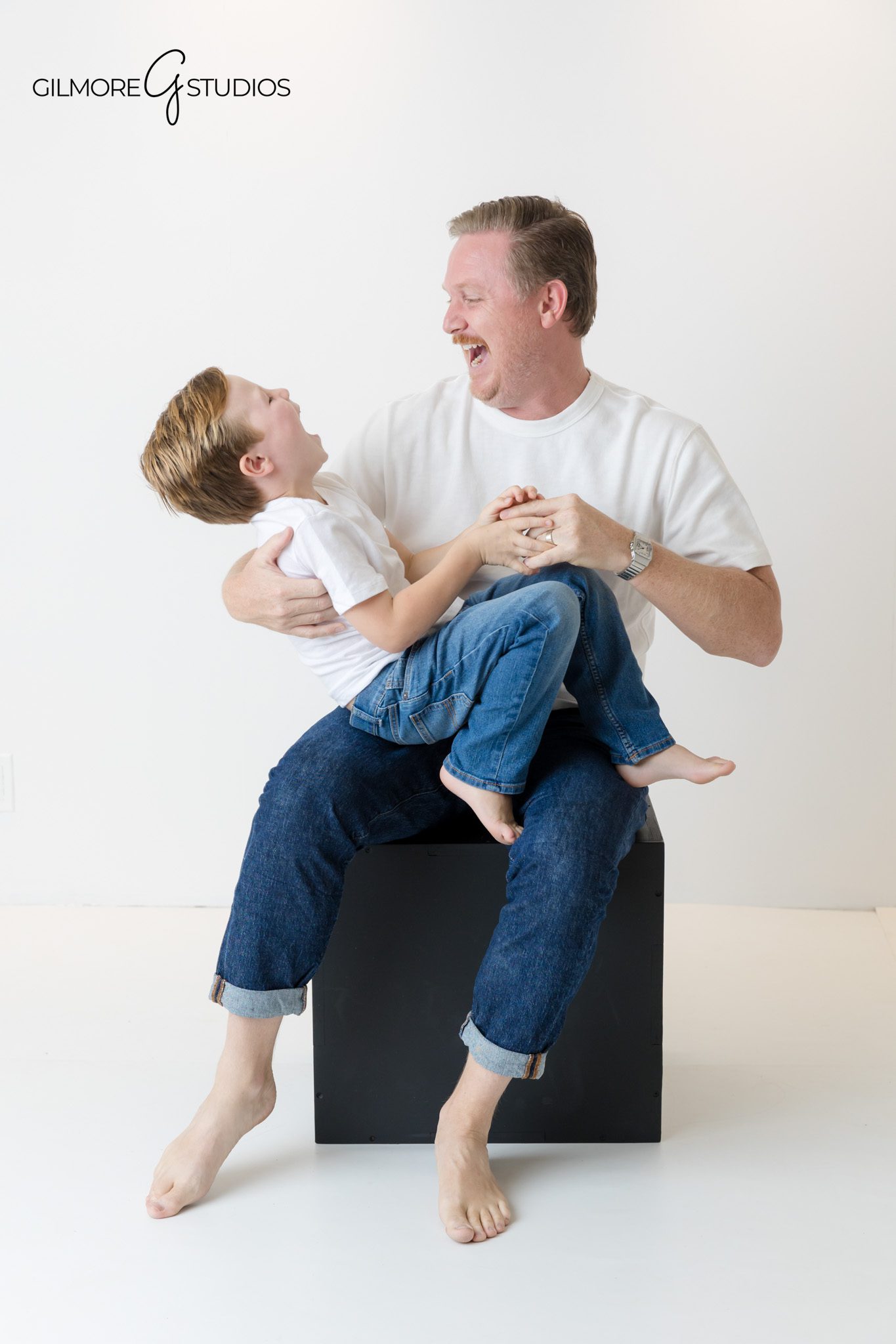 Orange County portrait photography with white shirts and denim theme.

Family photographer creating clean and modern studio portraits.