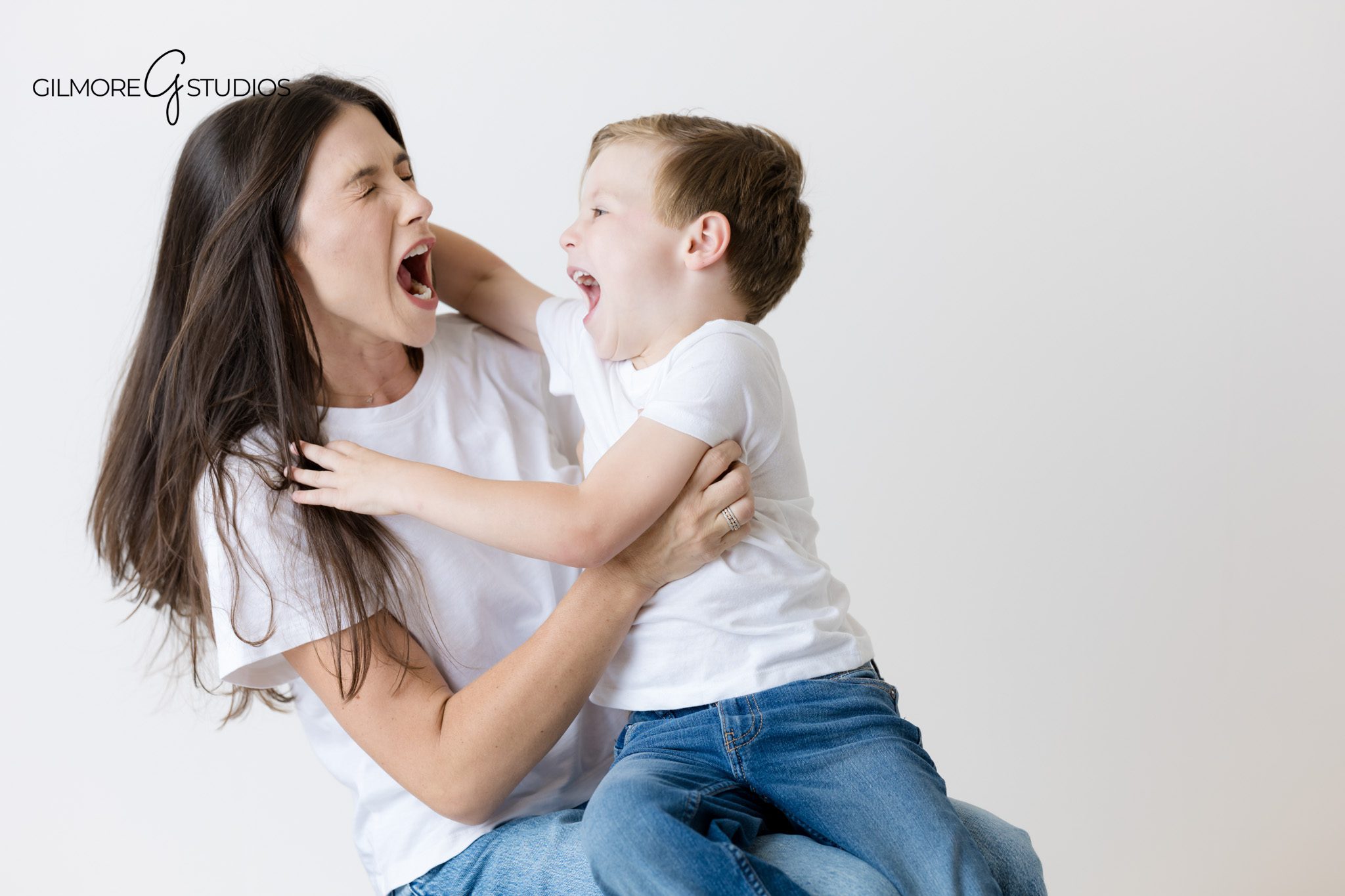 Studio portraits showing siblings in matching white shirts.

Orange County photography with soft tones and minimal wardrobe.