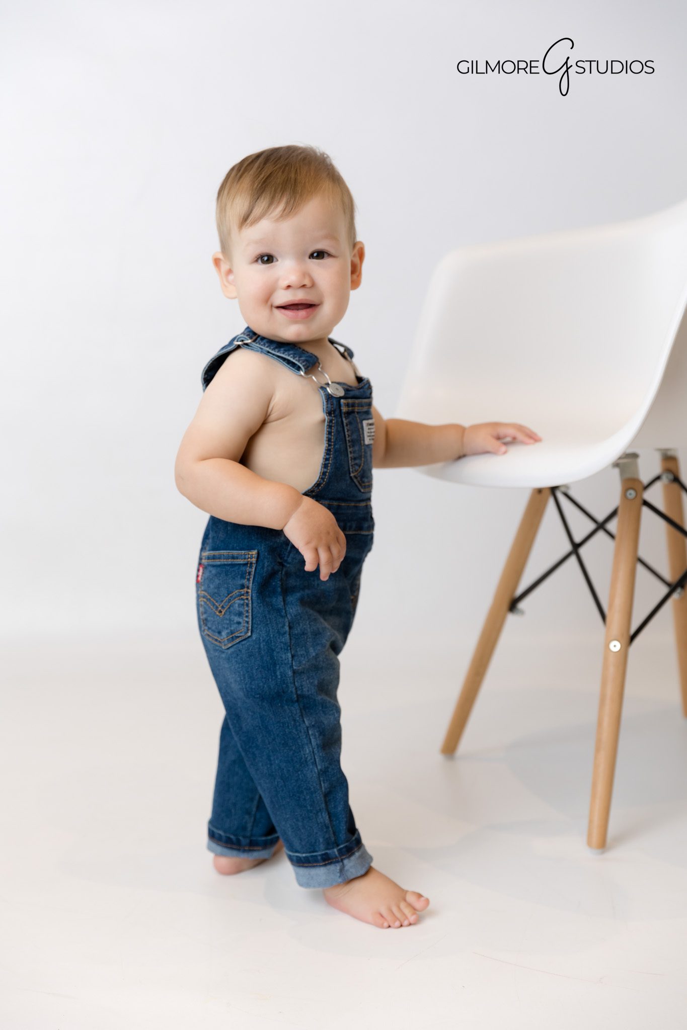 Baby portrait with primary color themed decorations.

Professional birthday photographer capturing cake details.