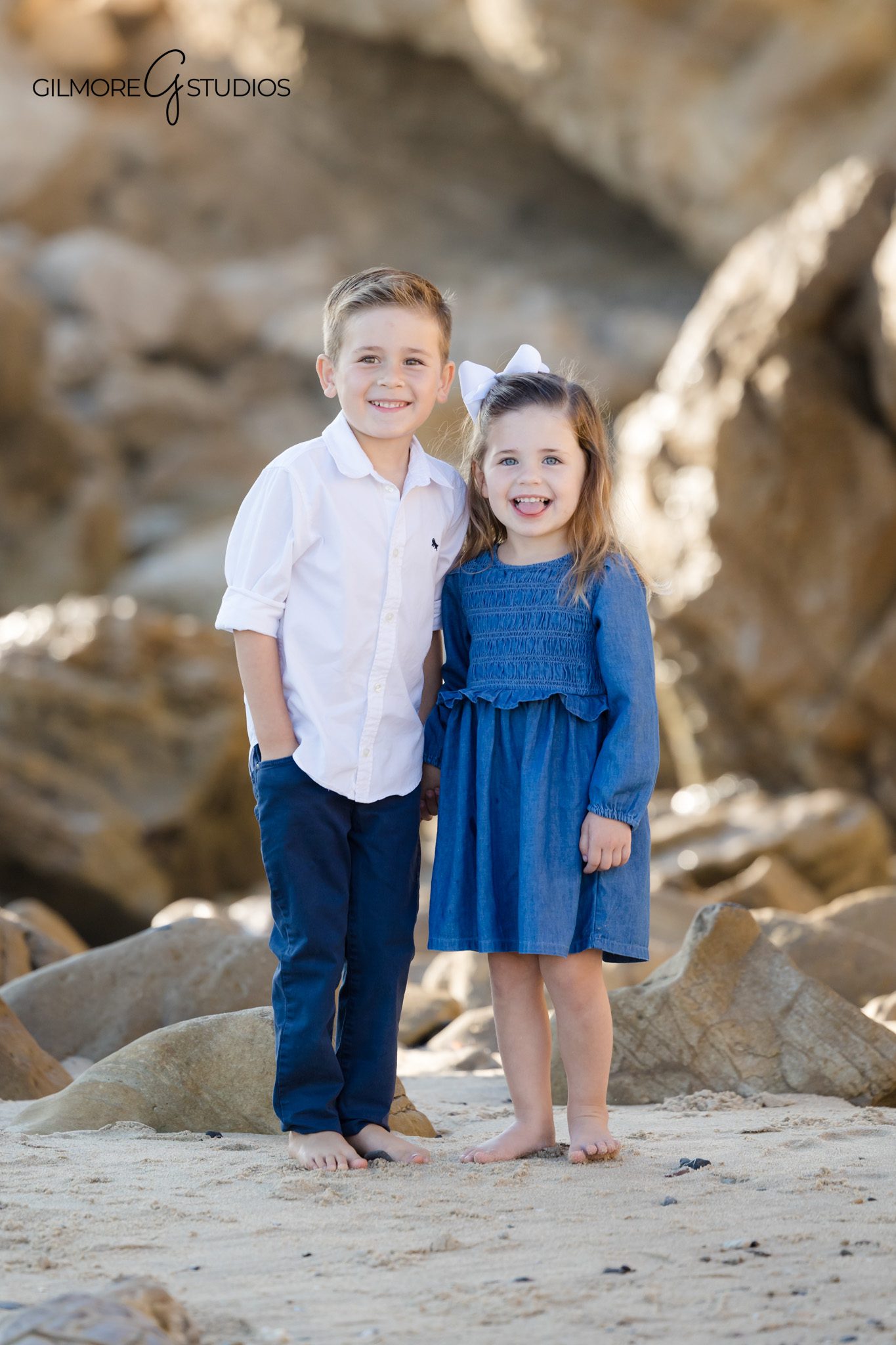 Newport Beach family portrait photography during low tide.

Gilmore Studios photographer capturing family playing near shoreline.