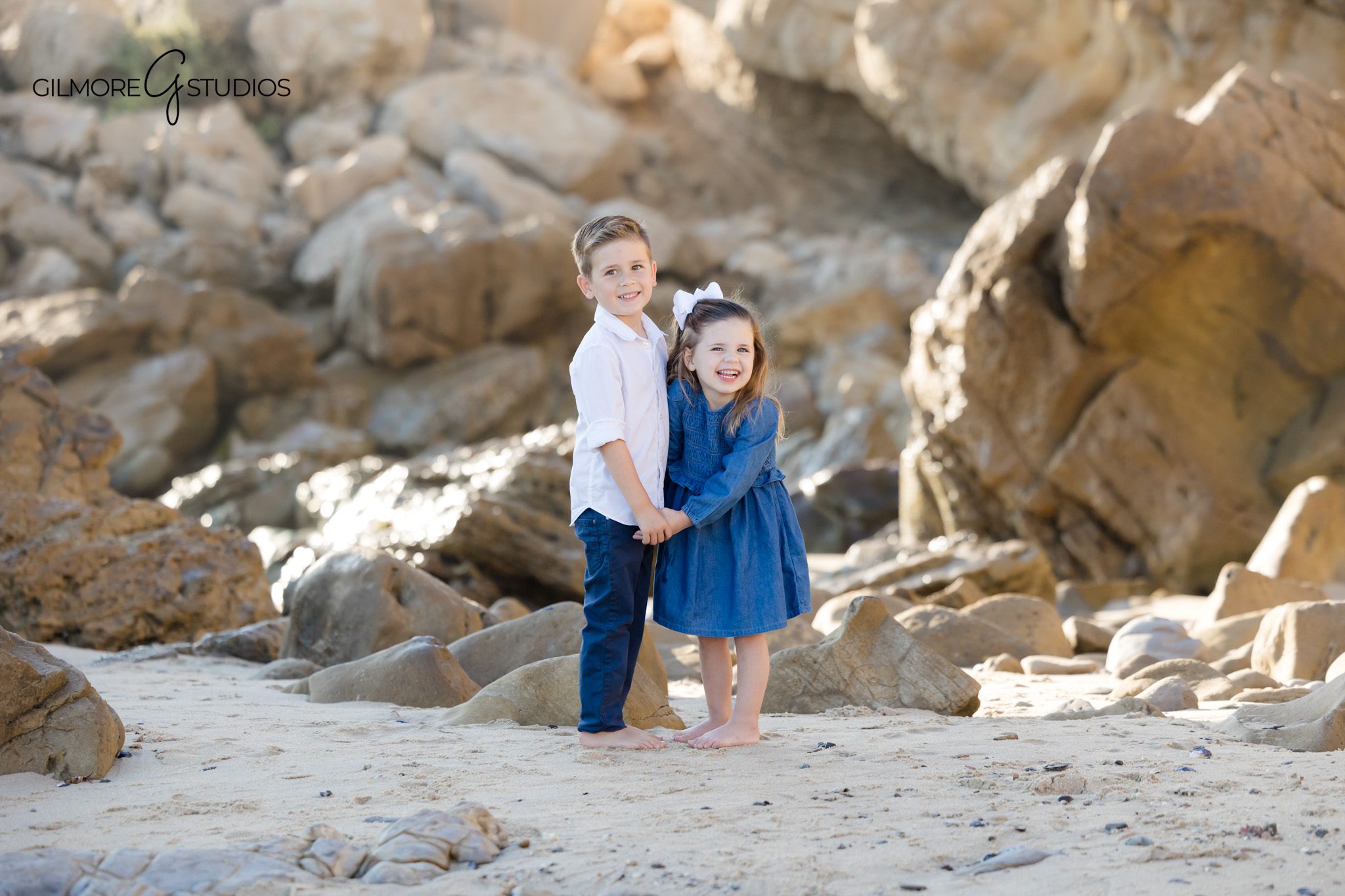 Corona del Mar family portraits with dreamy beach lighting.

Orange County photographer capturing kids running on beach path.