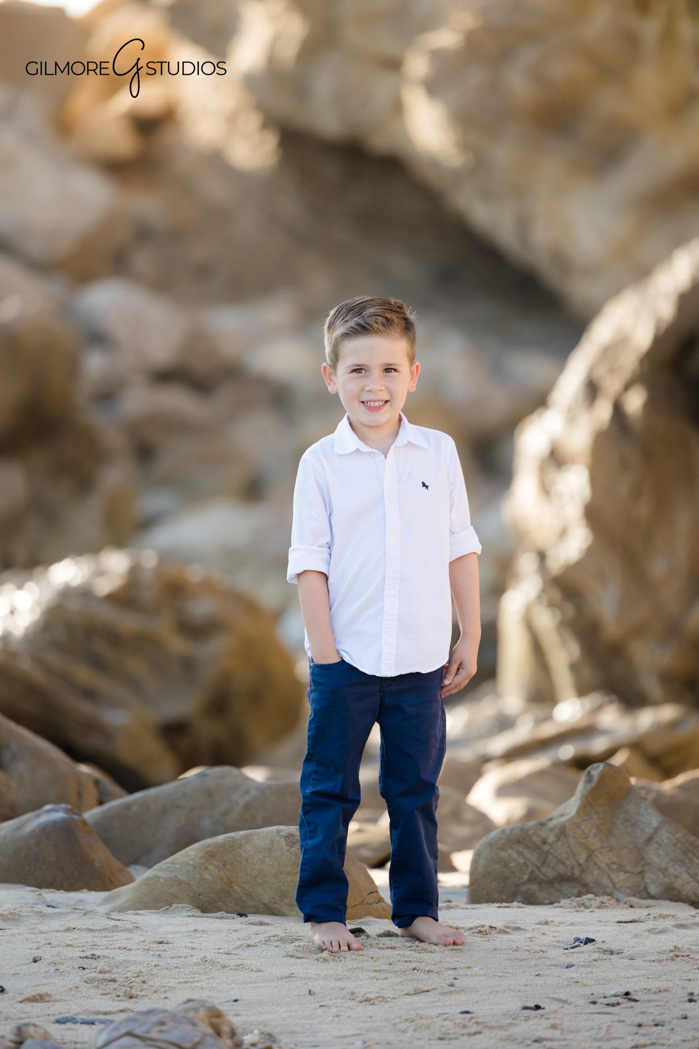 Newport Beach family photographer capturing barefoot beach portraits.

Sunset portrait photography at Little Corona overlooking ocean waves.