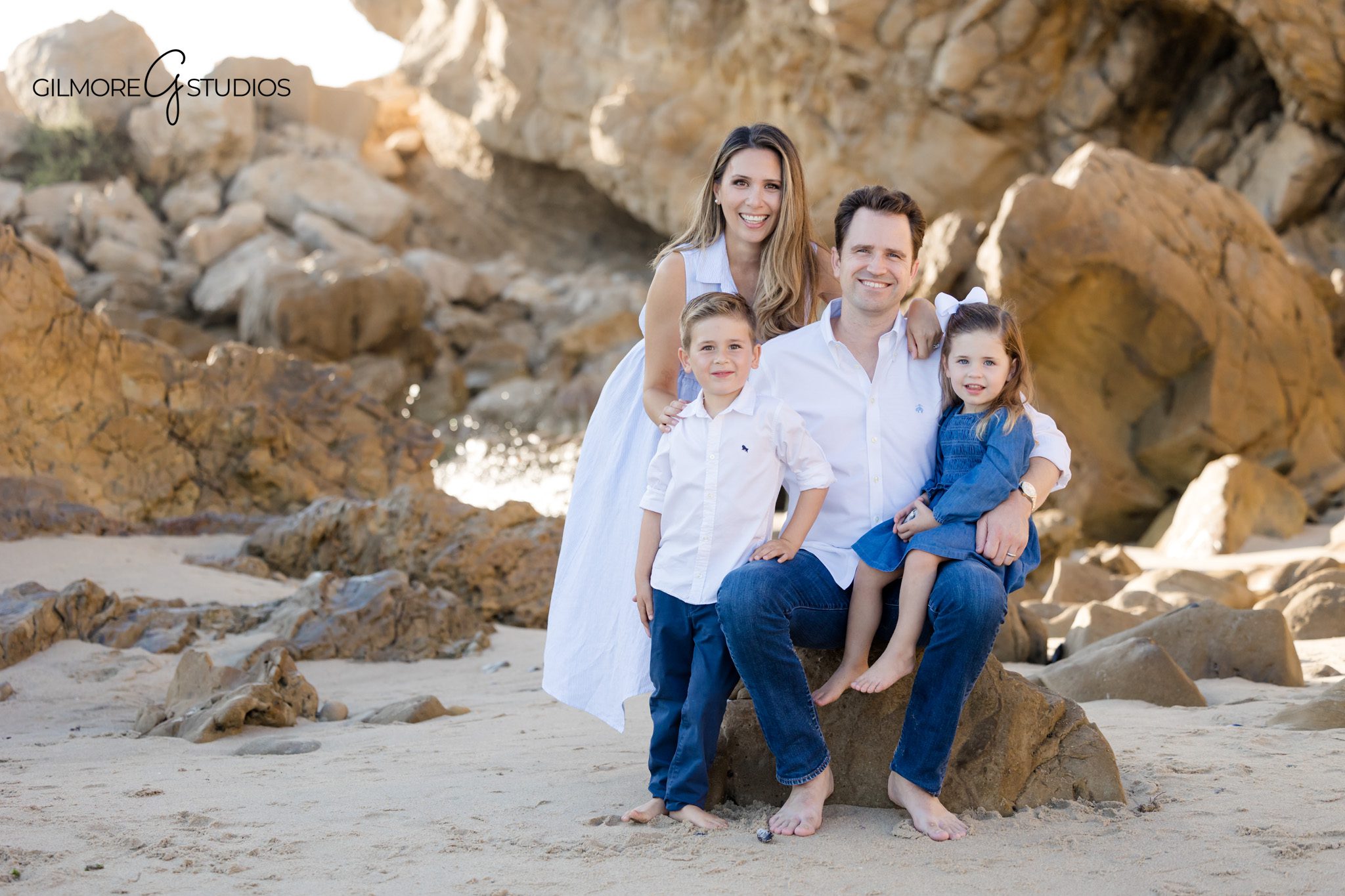 Gilmore Studios photographer capturing siblings playing at Little Corona.

Newport Beach family photography with ocean backdrop at Little Corona.