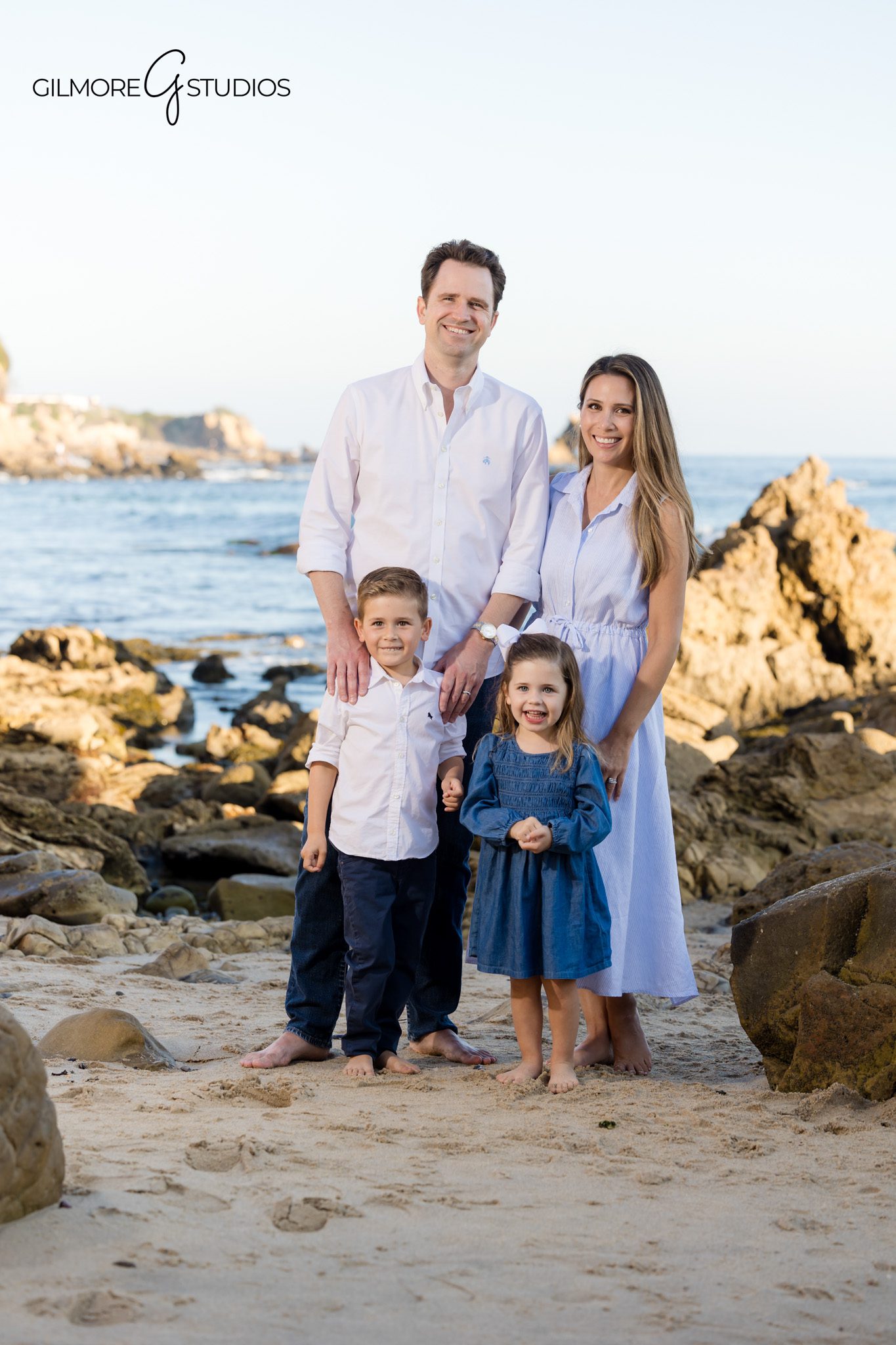 Orange County photographer documenting family walking along Little Corona shoreline.

Sunset family portrait photography in Corona del Mar with soft coastal light.