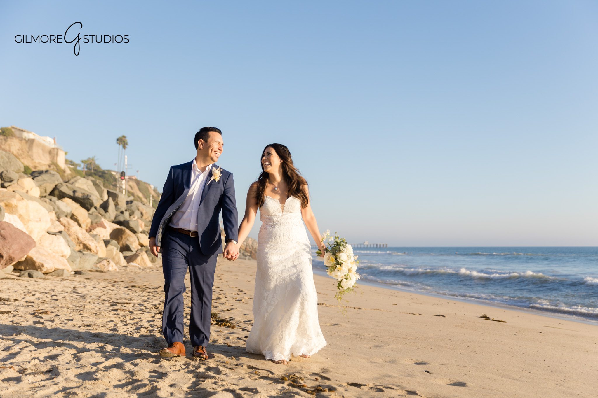 Bride and groom photography session at San Clemente Beach during sunset

San Clemente beach bridal portrait photography with elegant styling