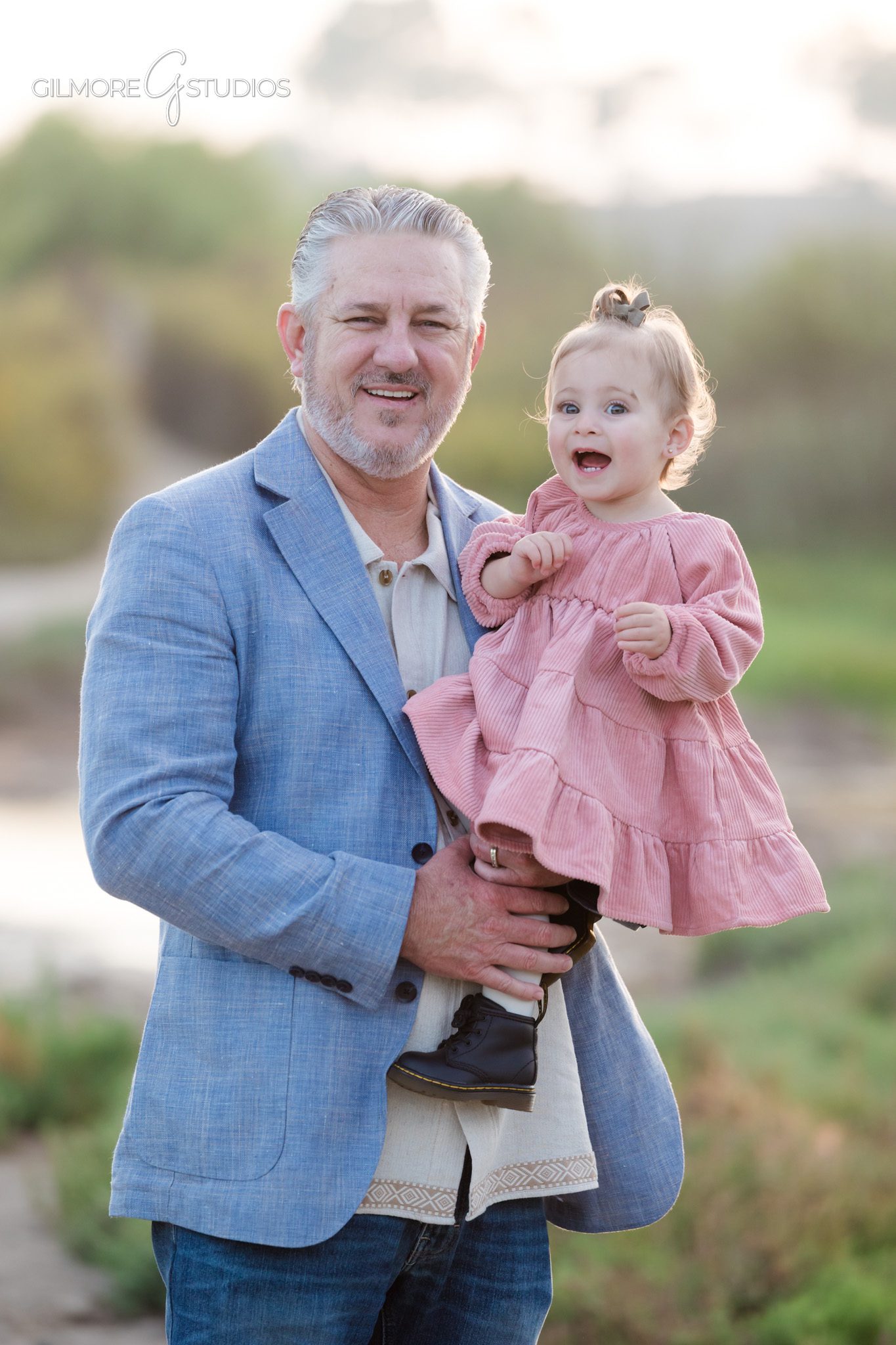 Extended family photography of parents and adult children at Back Bay.

Newport Beach portrait photographer capturing family connection at Back Bay.