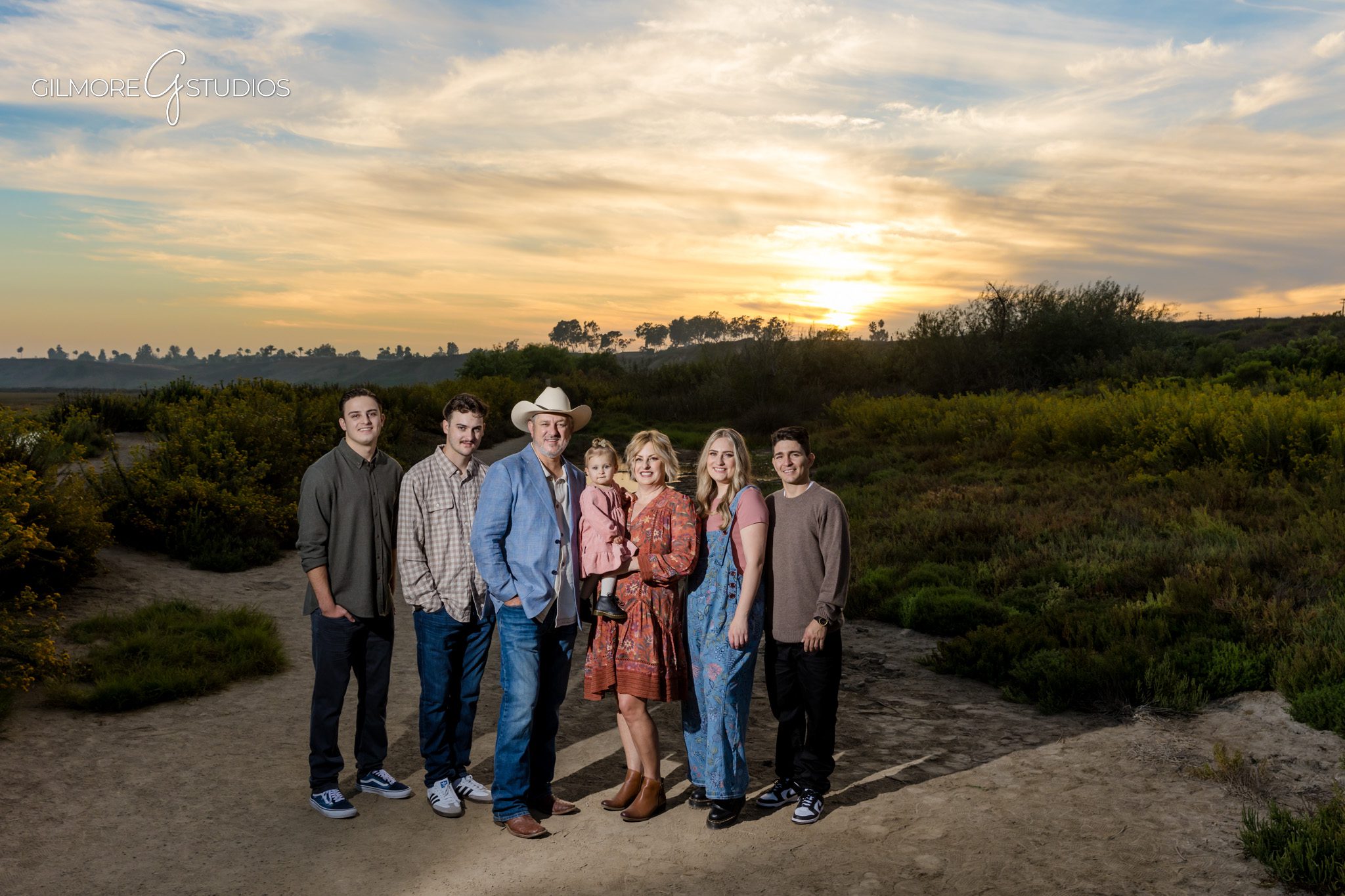 Newport Beach photographer capturing grandparents with grandchildren at Back Bay.

Outdoor family photography showing candid moments at Newport Back Bay.