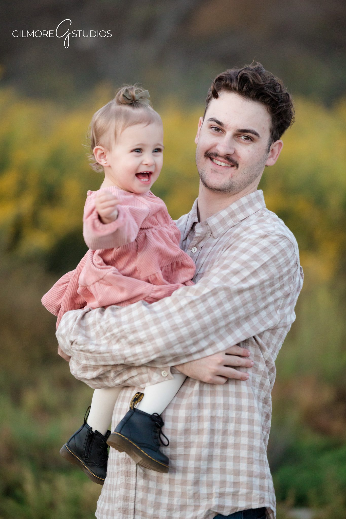 Back Bay family photography with warm tones and coastal setting.

Photographer capturing authentic family moments in Newport Back Bay.