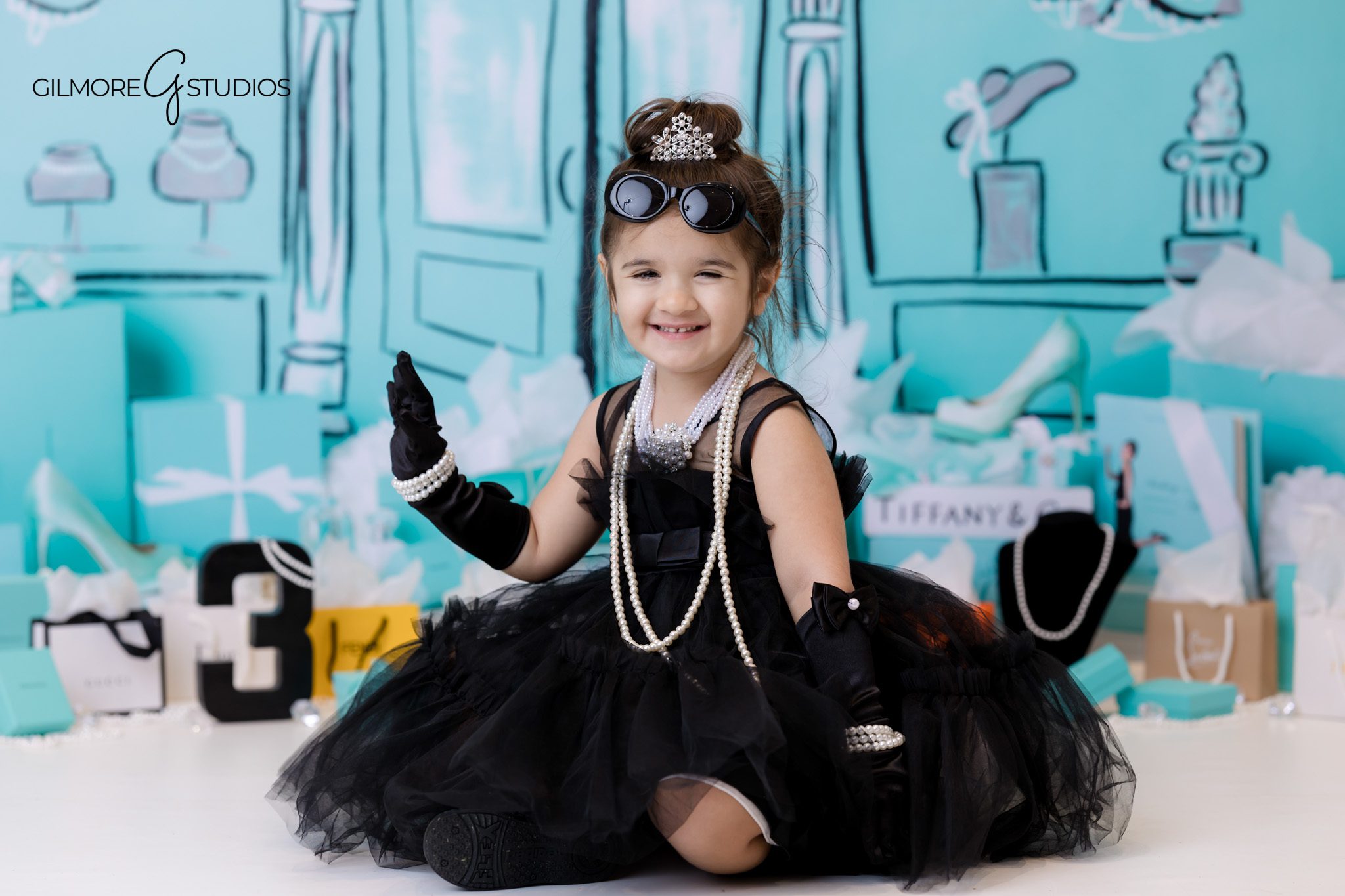 Tiffany birthday theme photographer capturing styled cake table.
Professional birthday photography with Tiffany style decorations and bow details.