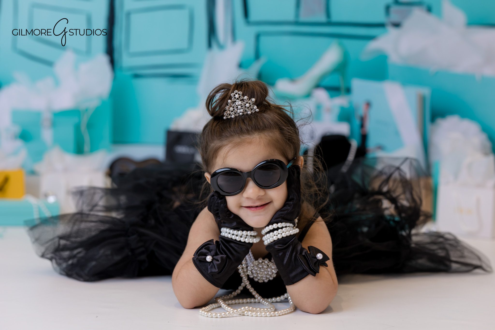 Tiffany’s theme 3rd birthday photographer capturing elegant turquoise party setup.
Tiffany blue birthday photography for three year old girl in studio.