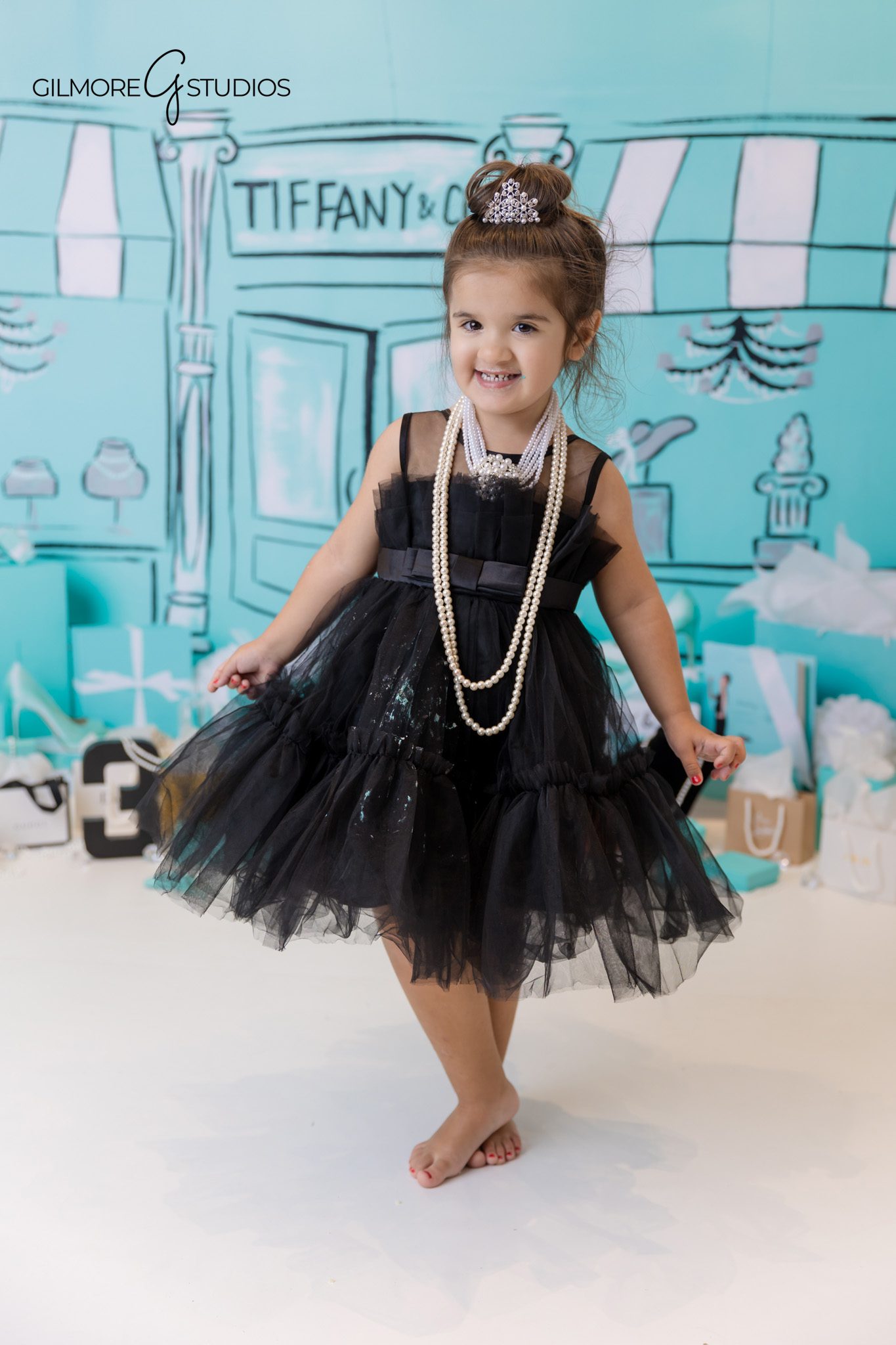 Tiffany theme child portrait session with polished birthday styling.
Birthday photographer capturing elegant teal and white birthday set.