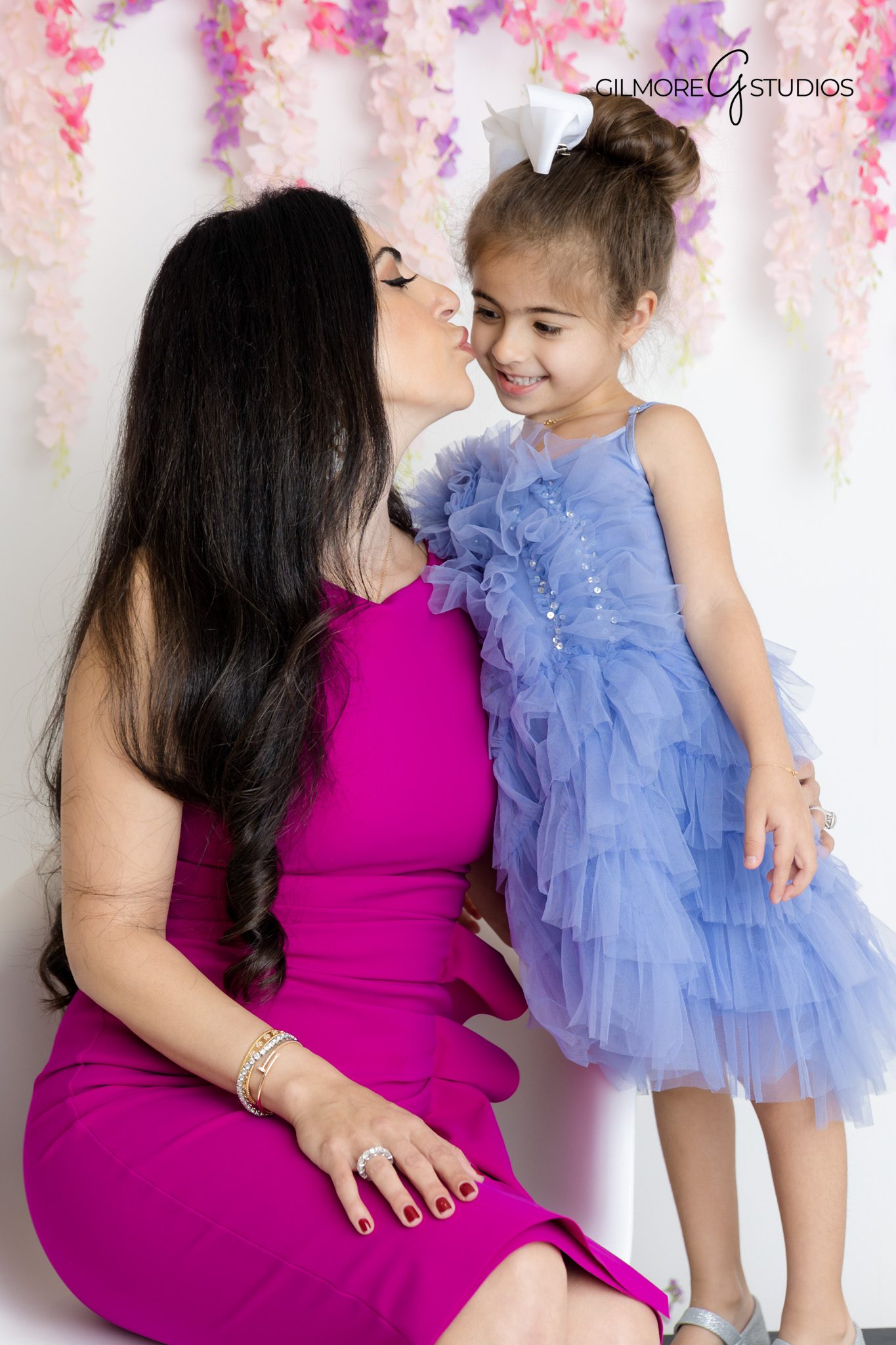 Ice princess portrait photography with detailed costume styling.

Studio photographer capturing Frozen princess birthday smiles.