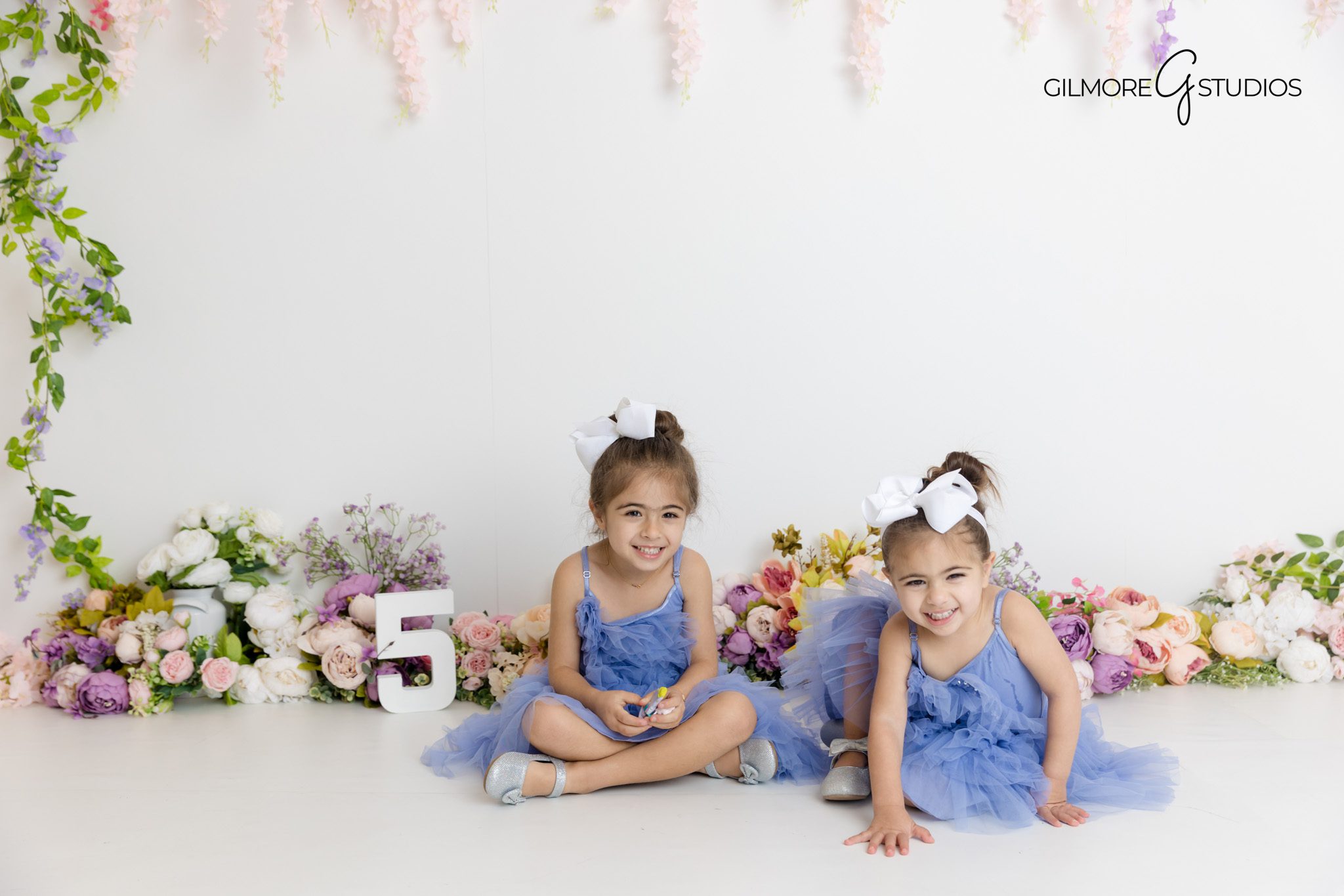 Studio Frozen theme photography with glittering white props.

Elsa inspired birthday portrait photographer capturing twirls.