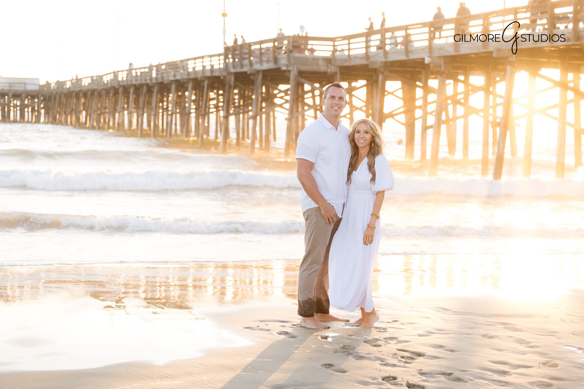 Newport Beach family session photographed at golden hour near the pier.
Warm sunset photography highlighting family connection in Newport Beach.